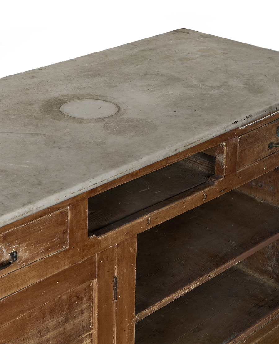 Vintage French oak bakery counter, distressed, showing chipped paint and detail of the marble top.