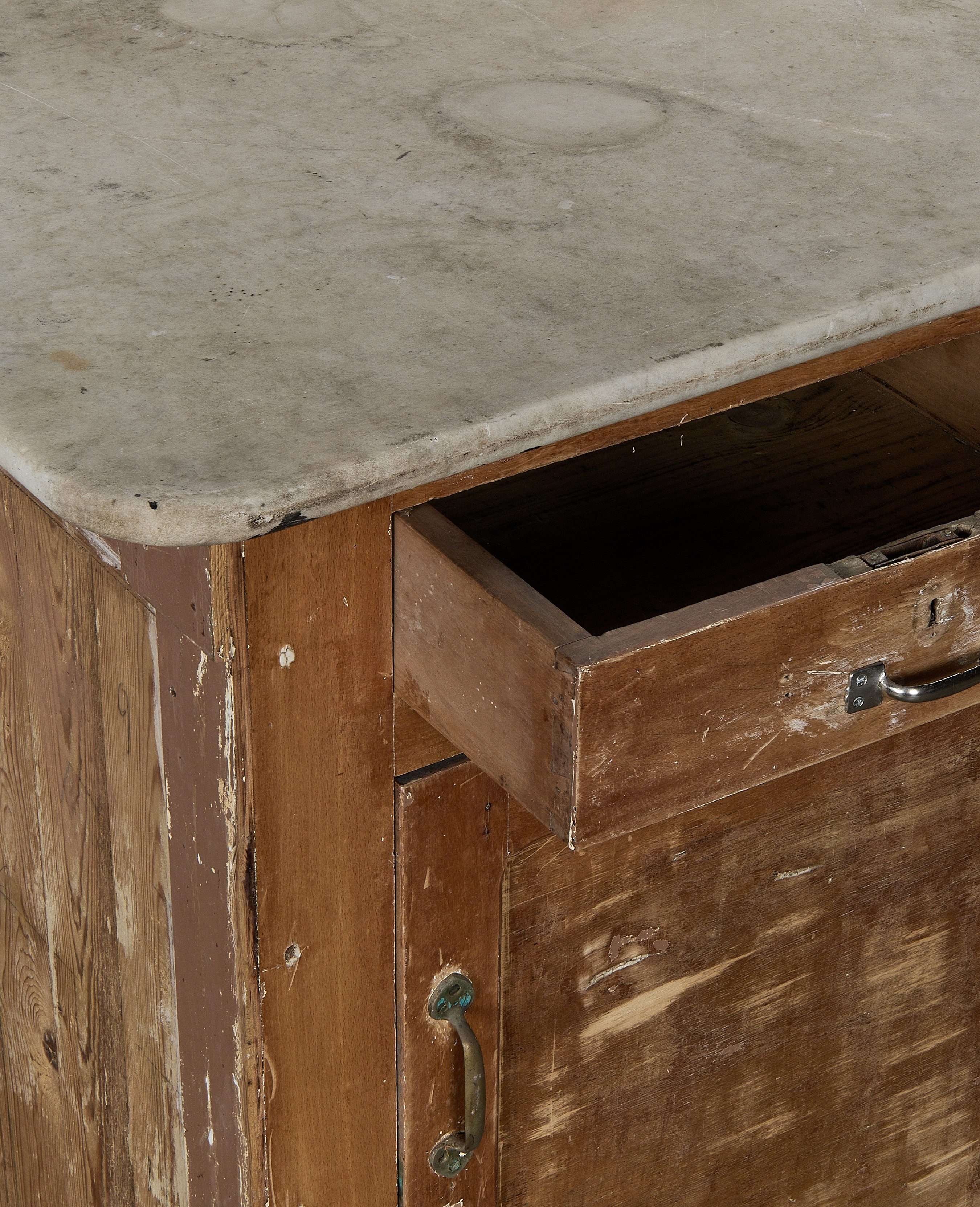 Vintage French oak bakery counter, distressed paintwork and worn marble top with open drawer.
