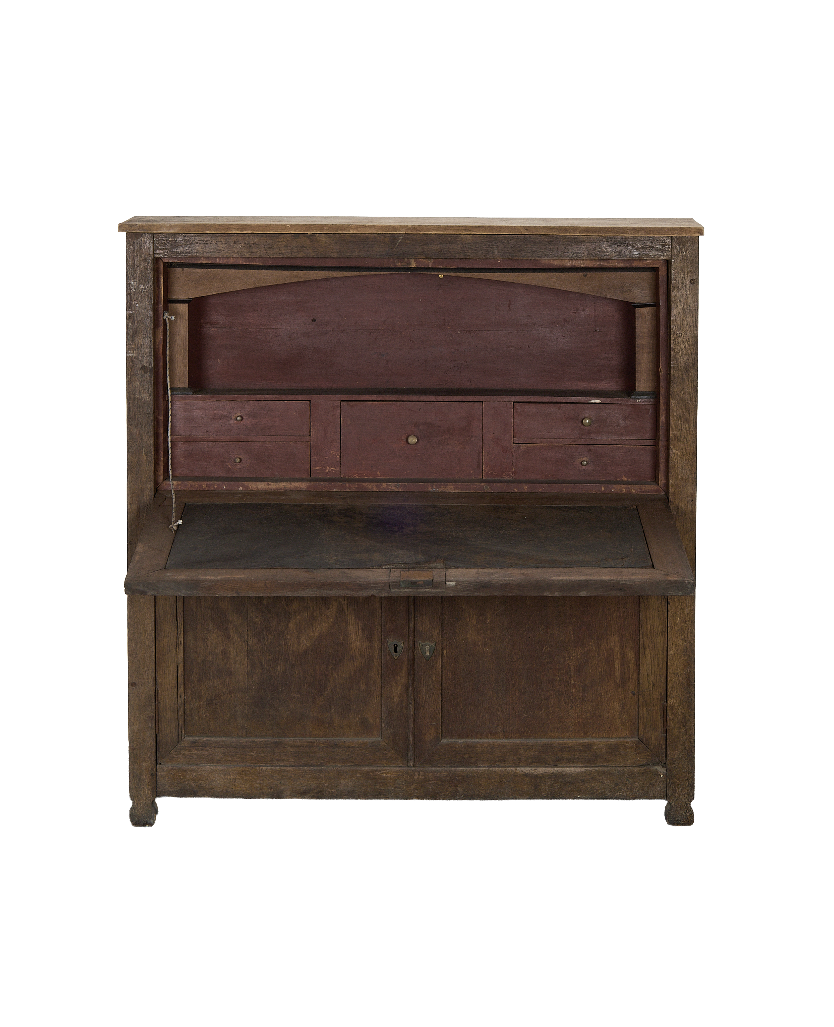 Vintage French oak desk cabinet, open, revealing distressed red interior and small drawers.