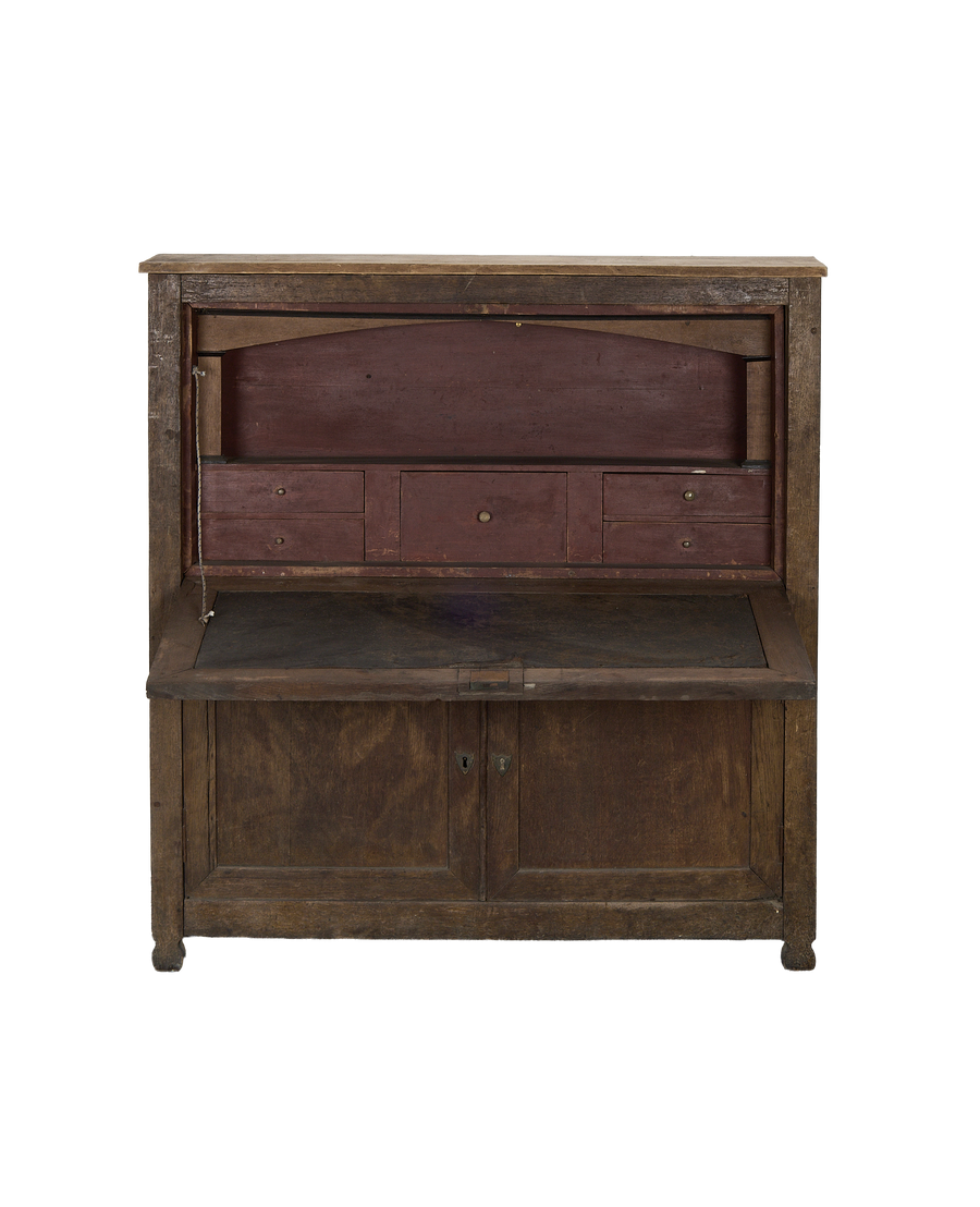 Vintage French oak desk cabinet, open, revealing distressed red interior and small drawers.