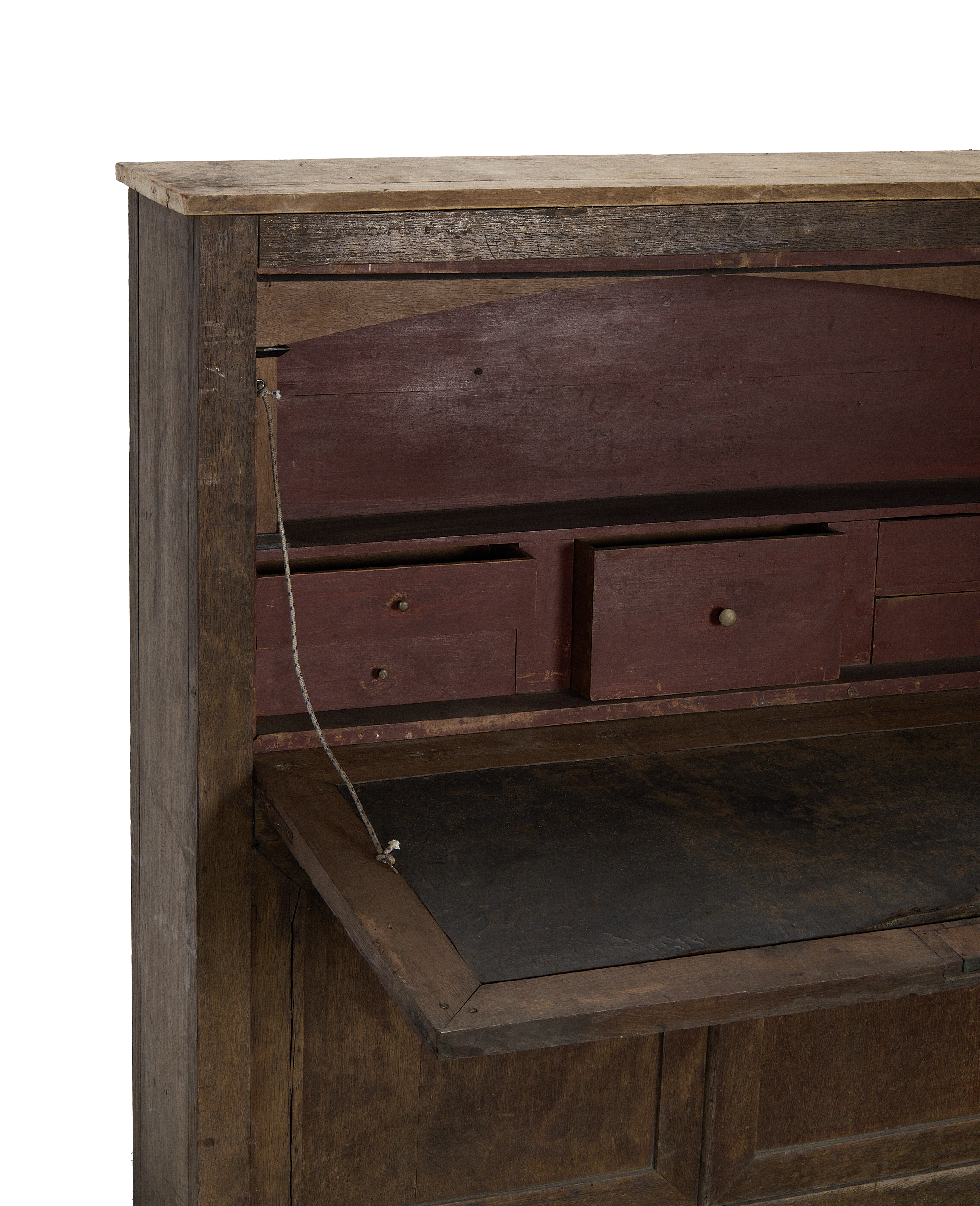 Vintage French oak desk cabinet interior, open with small drawers and worn writing surface.