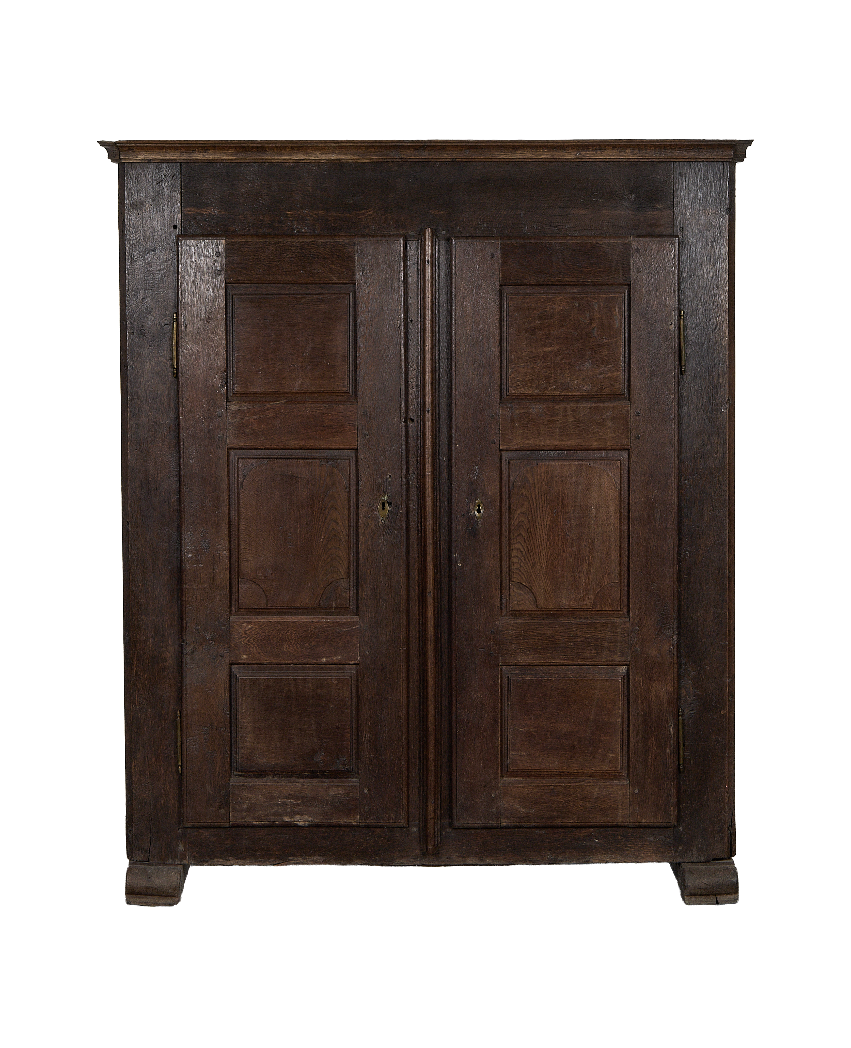 French 1850s vintage oak cabinet with dark patina, paneled doors, and escutcheons.