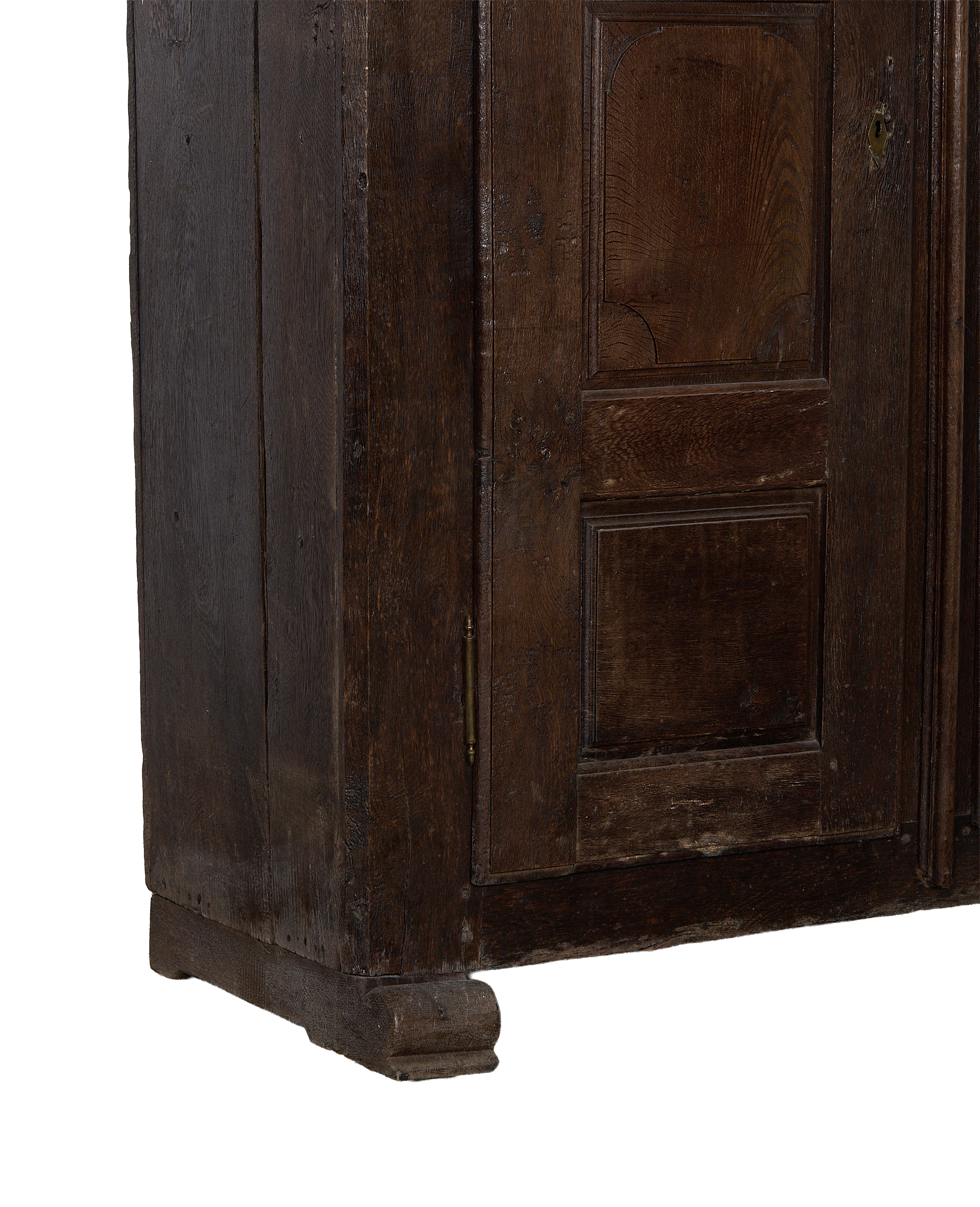 Close-up of vintage 1850s French oak cabinet, showing rustic plank detail and base.