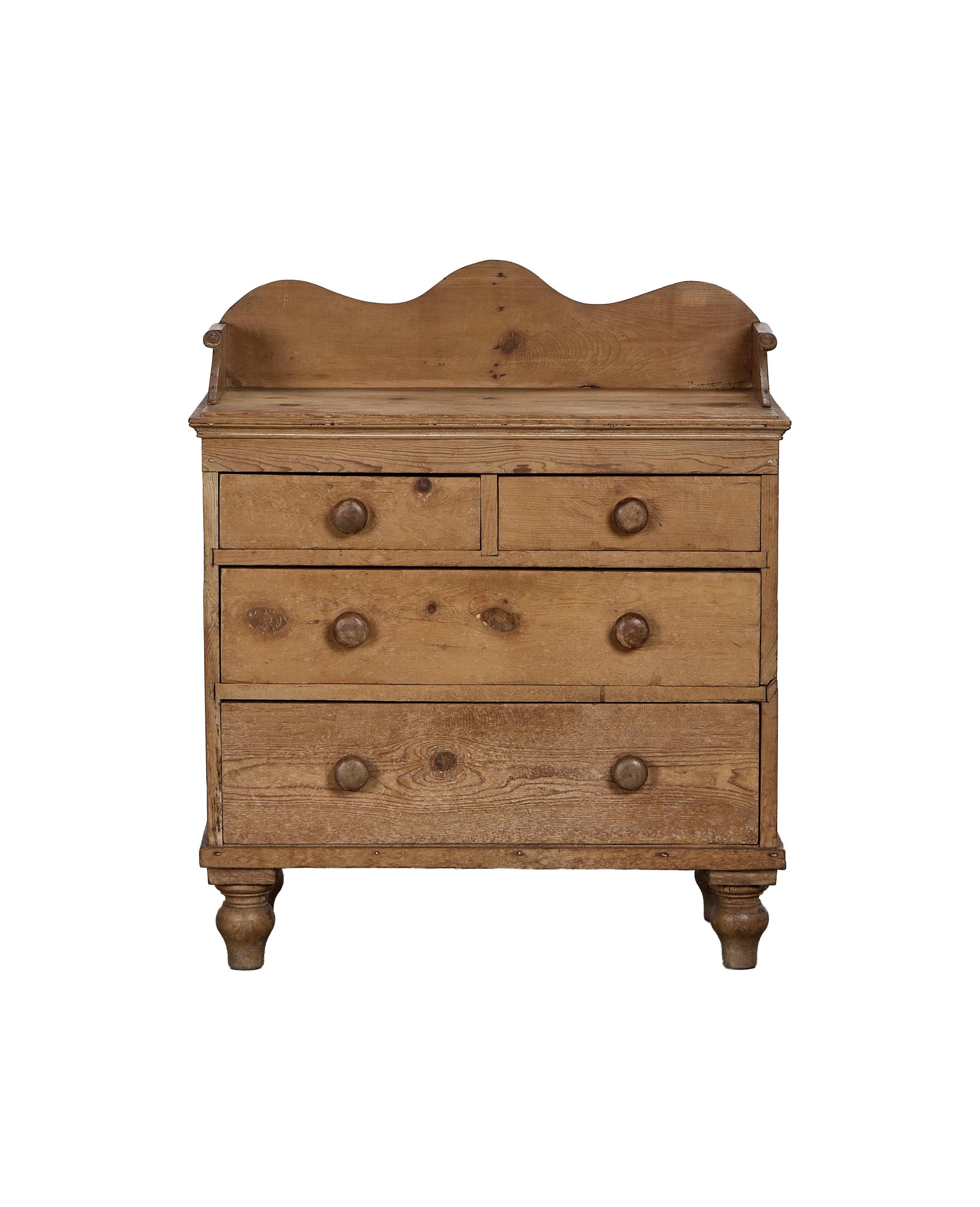 Vintage French pine chest of drawers with five brass-knobbed drawers and carved feet.