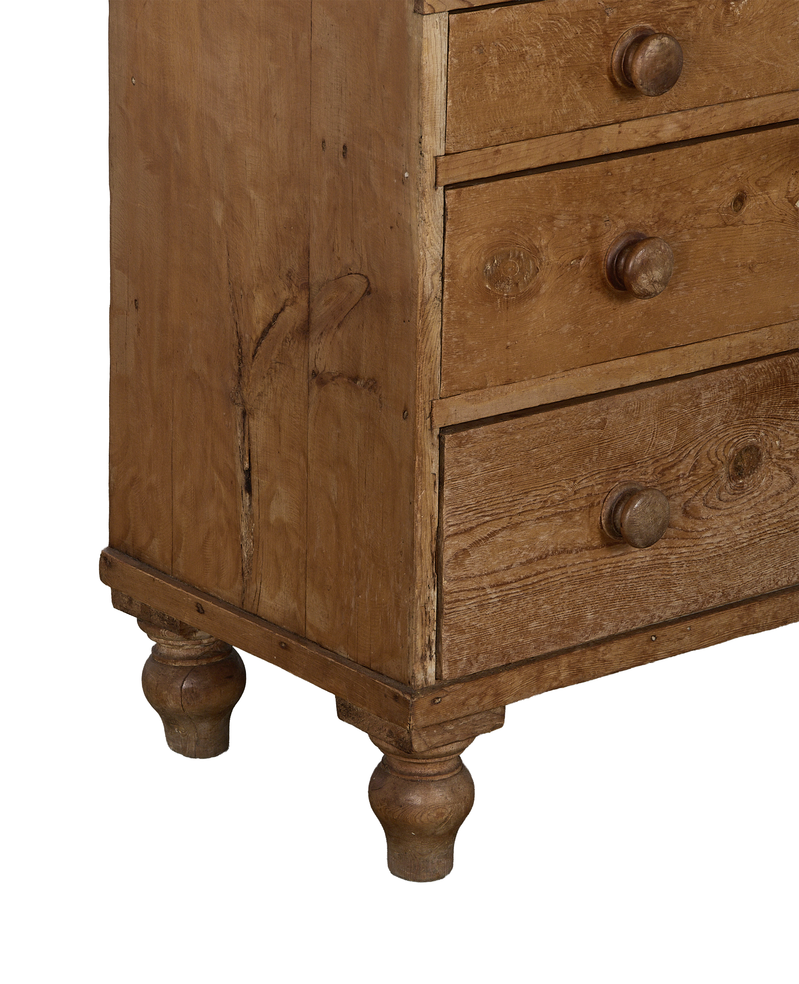 Vintage French pine chest of drawers, details of worn oak finish and round wooden feet.