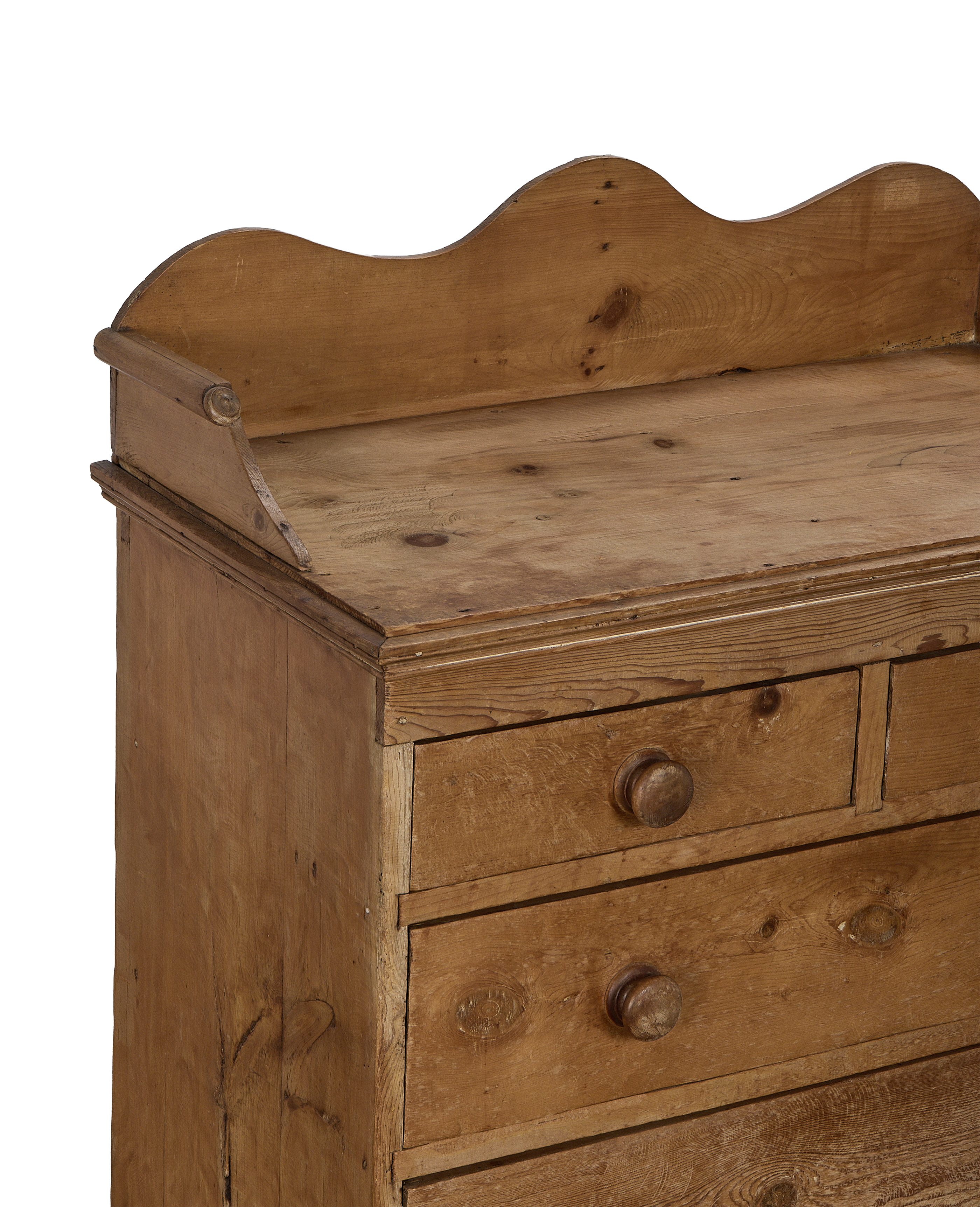 Vintage French pine chest of drawers, showing curved top backboard detail and knob.