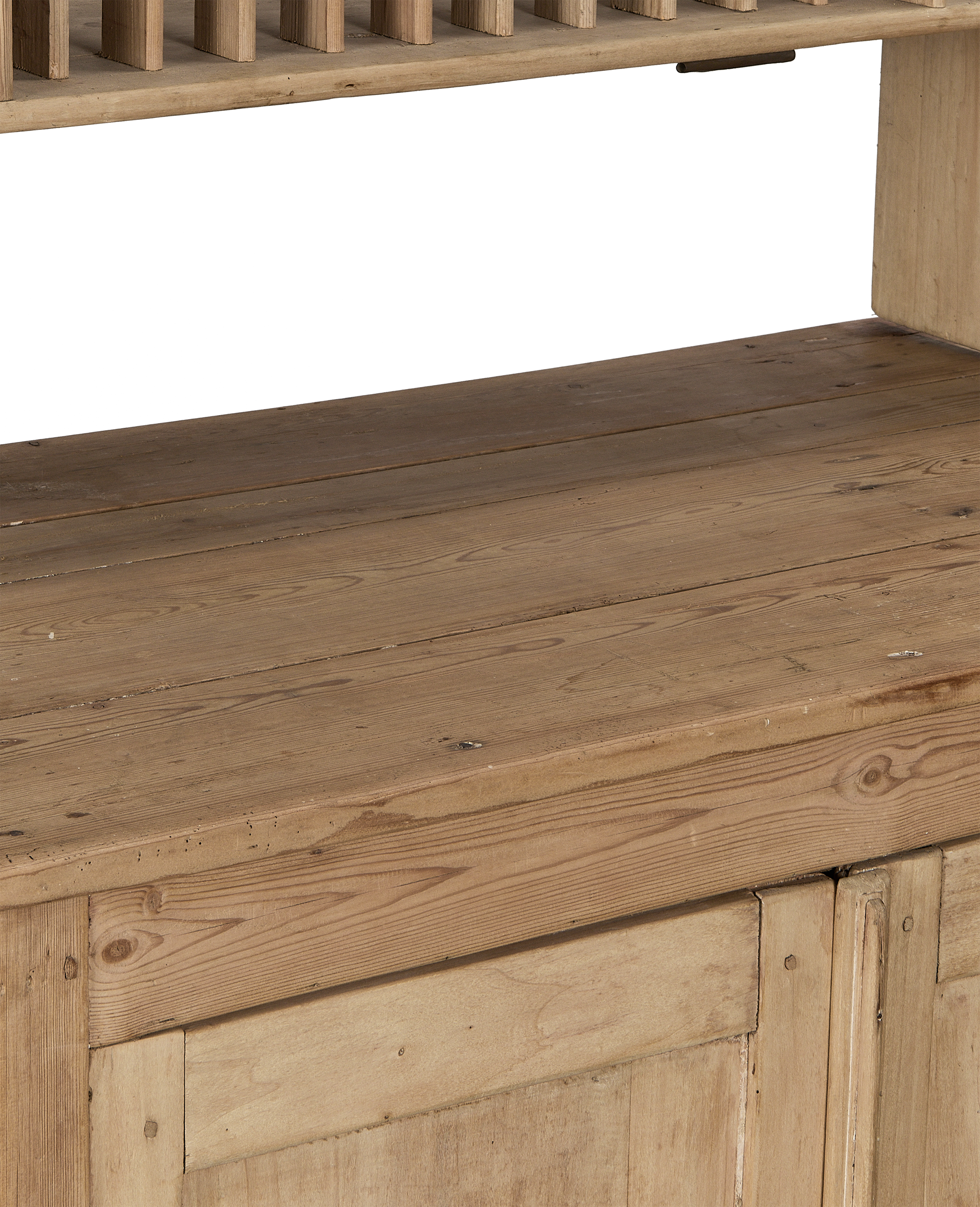 Vintage French Pine postal cabinet, close-up of natural wood grain, worn patina.