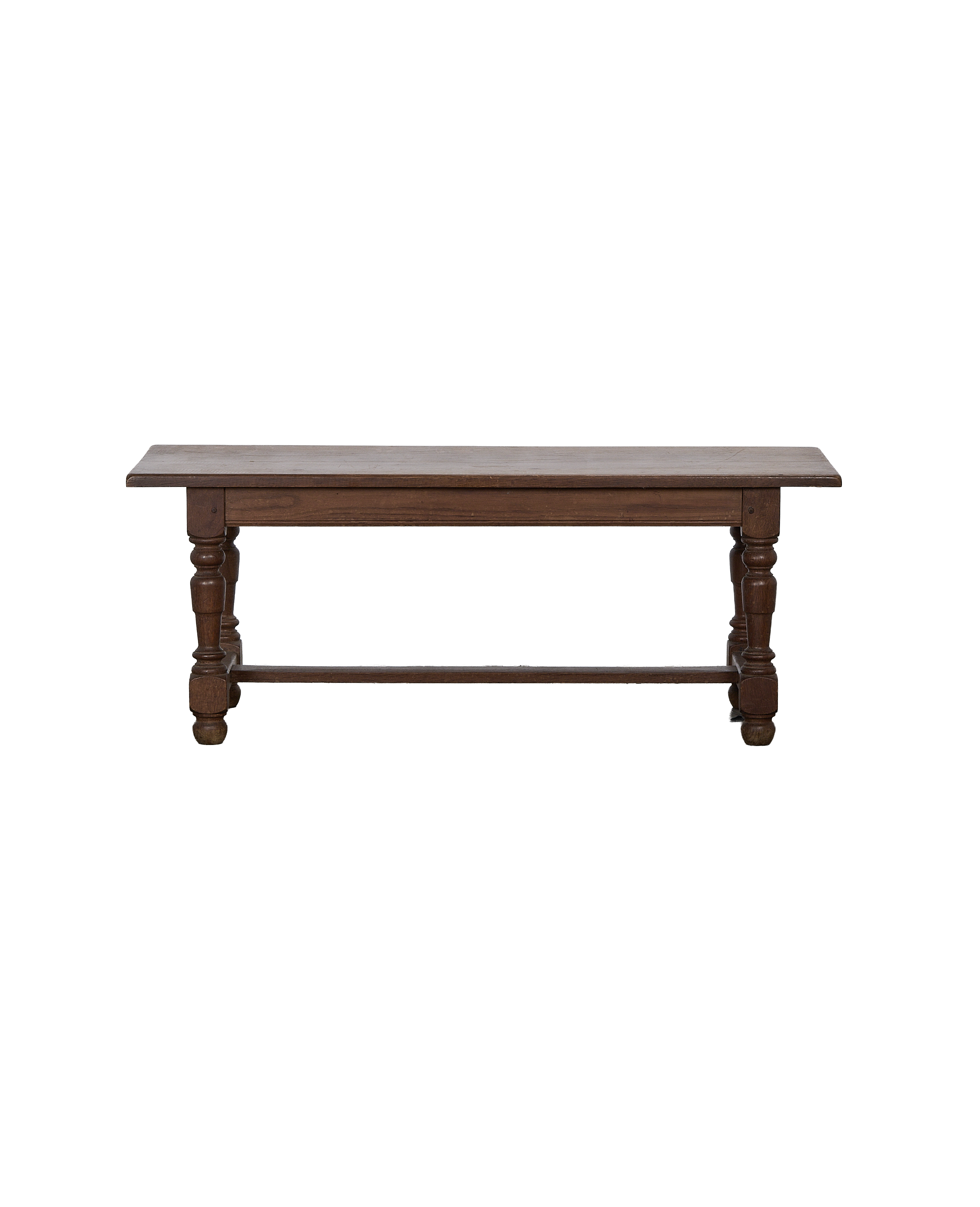 Vintage French oak coffee table, front view showing turned legs and stretcher.