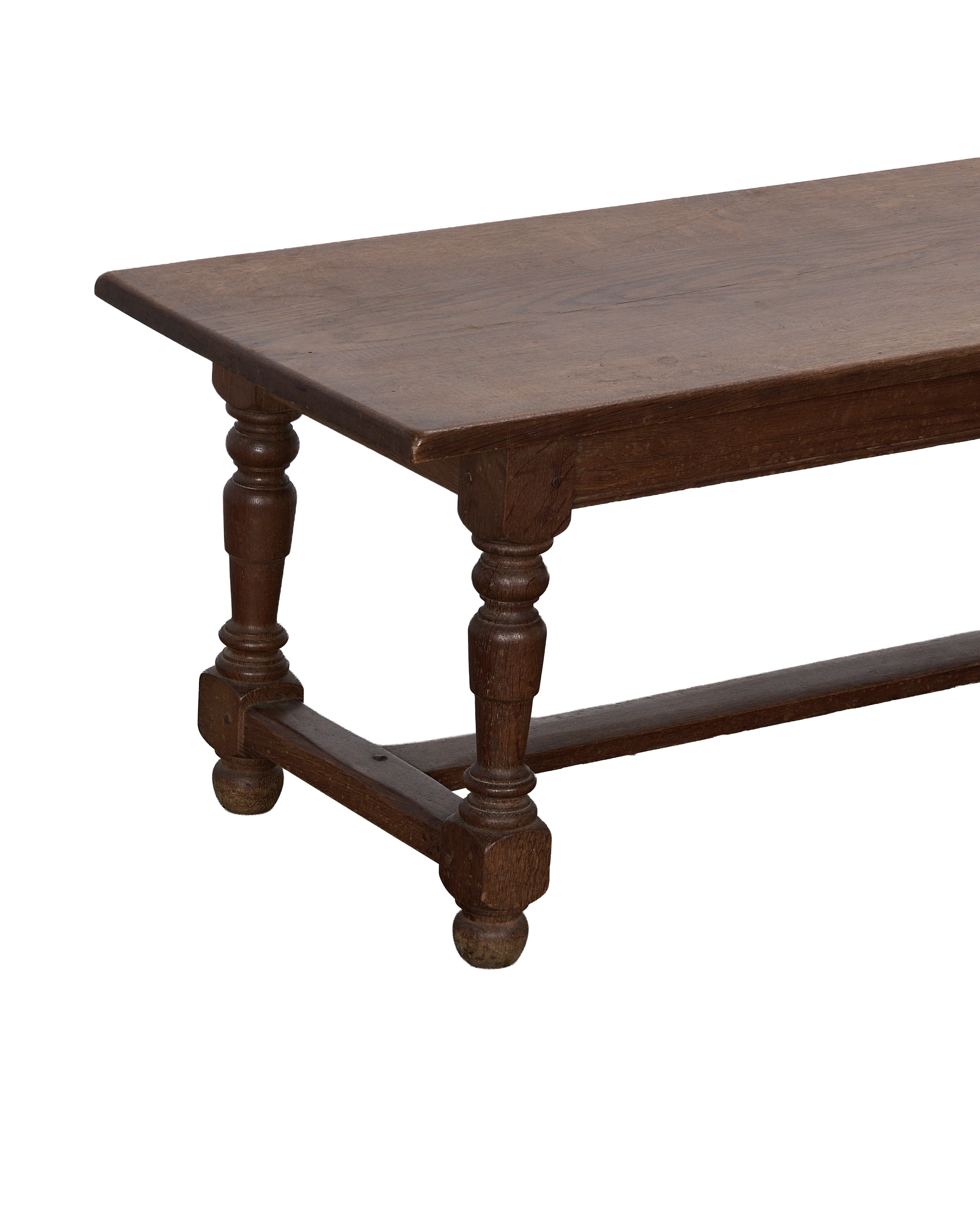 Vintage French oak coffee table, showcasing a turned leg and stretcher detail.