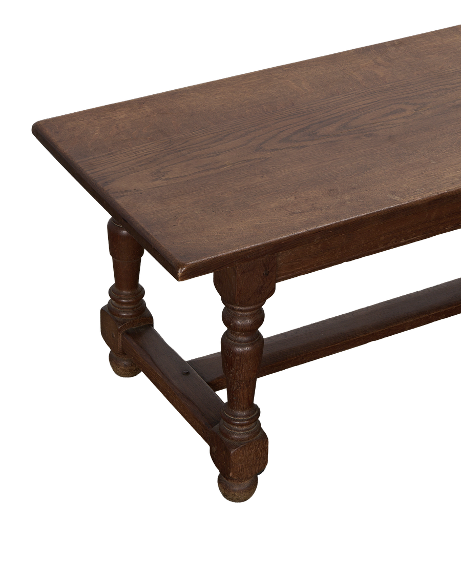 Vintage French oak coffee table, close-up top view of aged wooden surface.