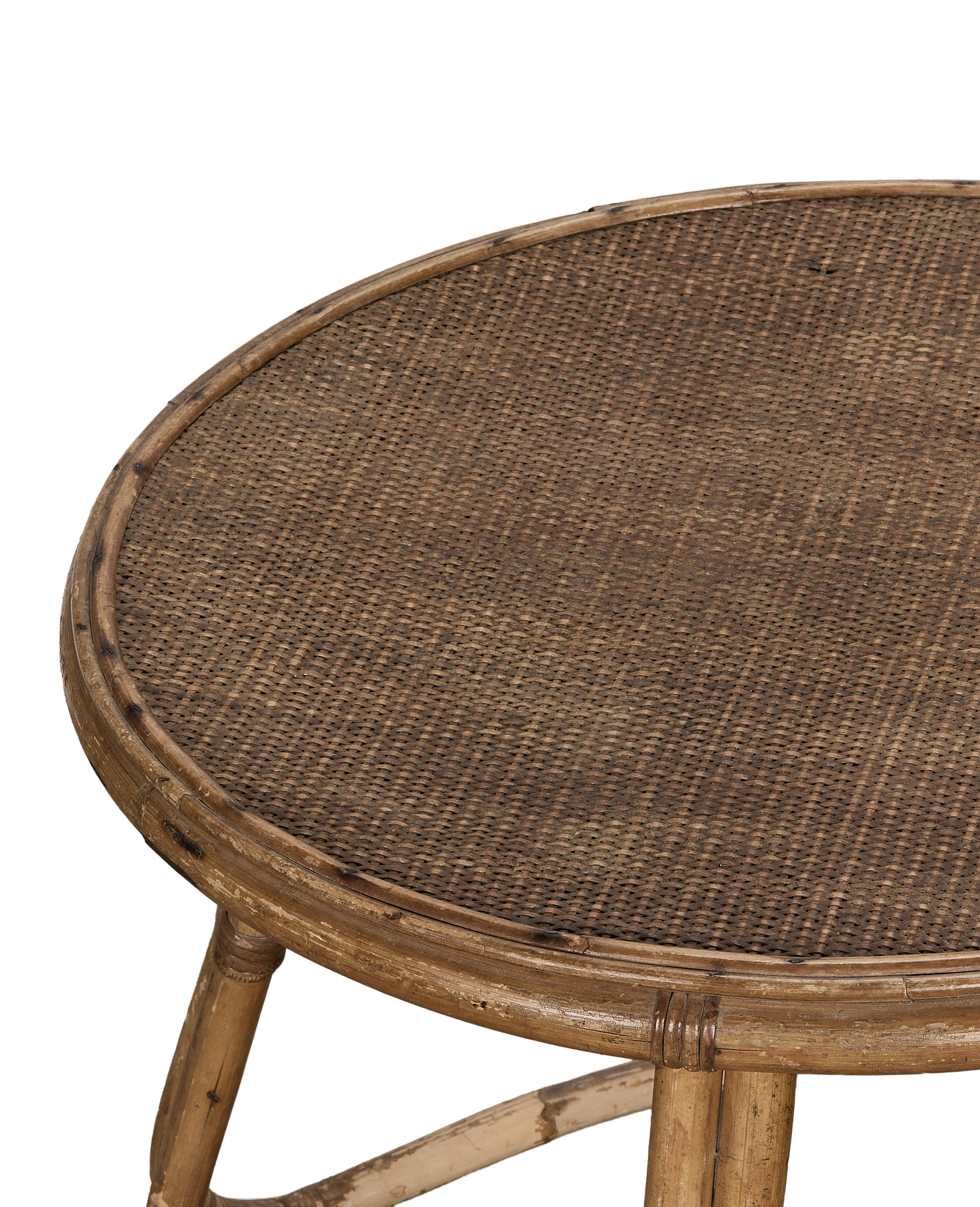 Vintage French bamboo coffee table, close-up of natural cane woven tabletop texture.