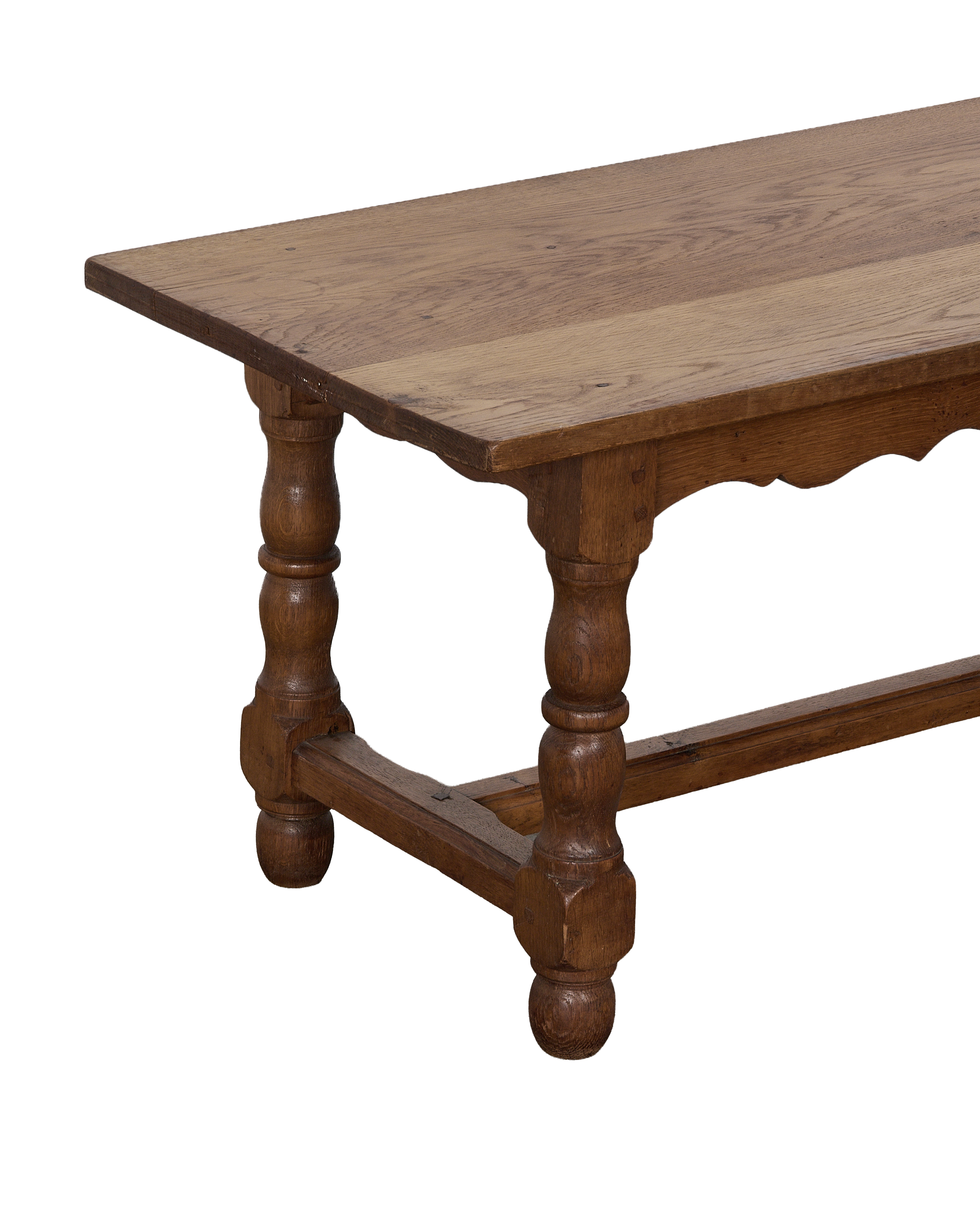 Vintage French oak coffee table, showcasing tabletop planks and decorative turned legs.