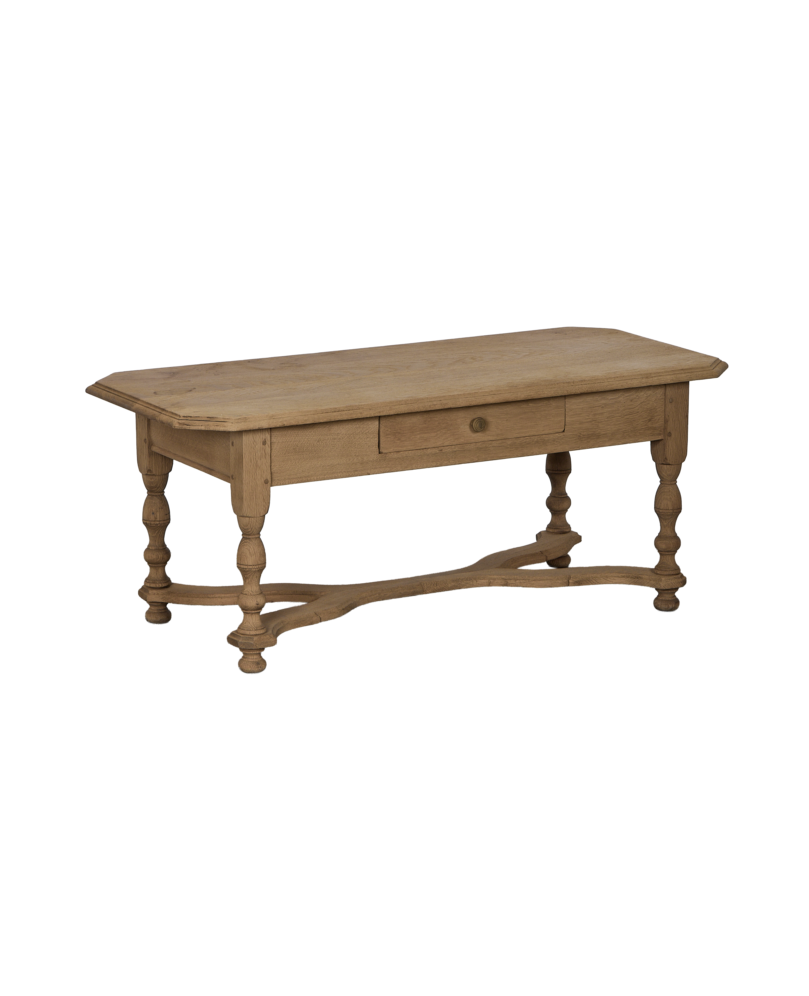 Vintage French oak coffee table with single drawer, turned legs, and stretcher base.