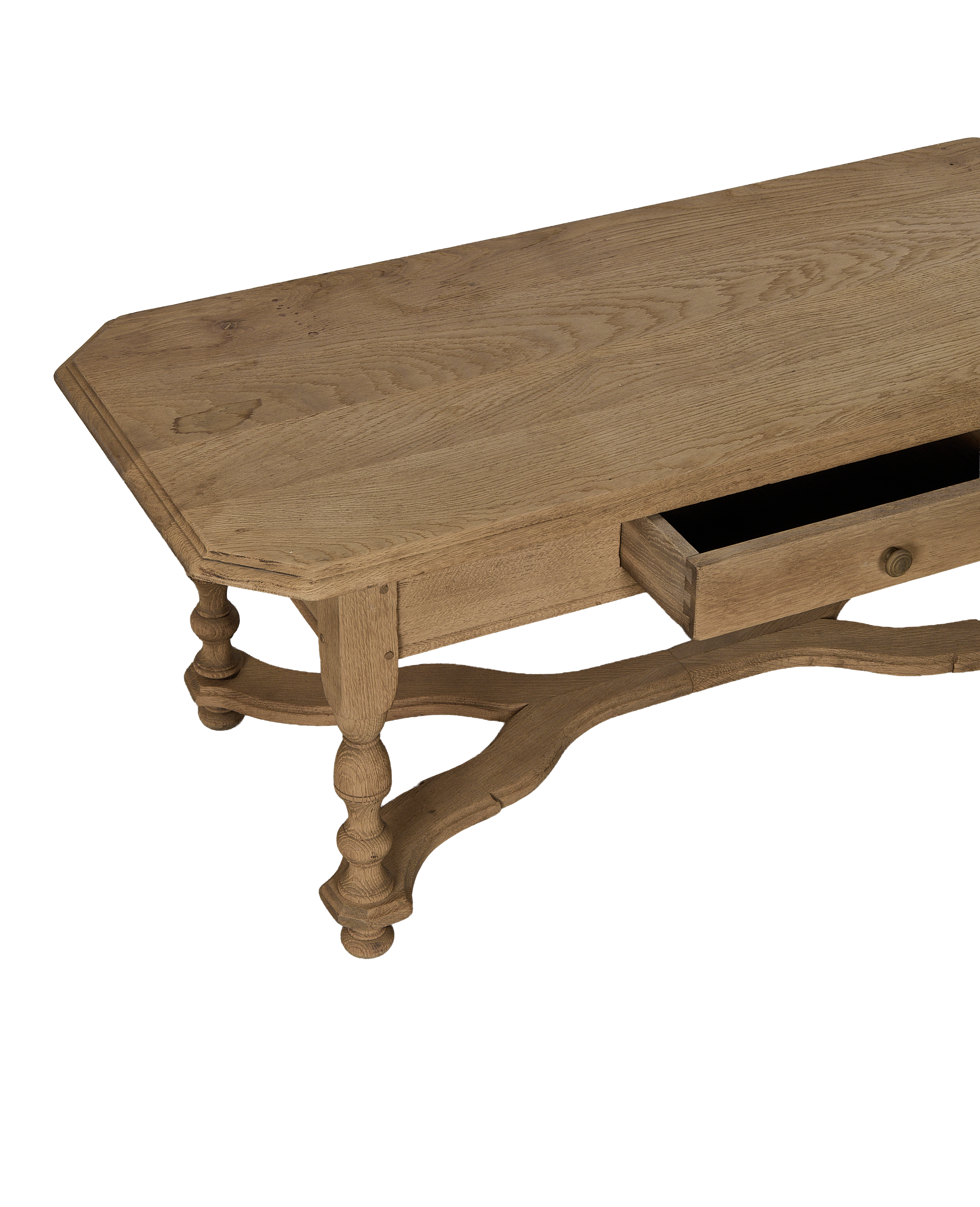 Vintage French Oak coffee table, showing opened dovetail drawer joinery and scrolled legs.