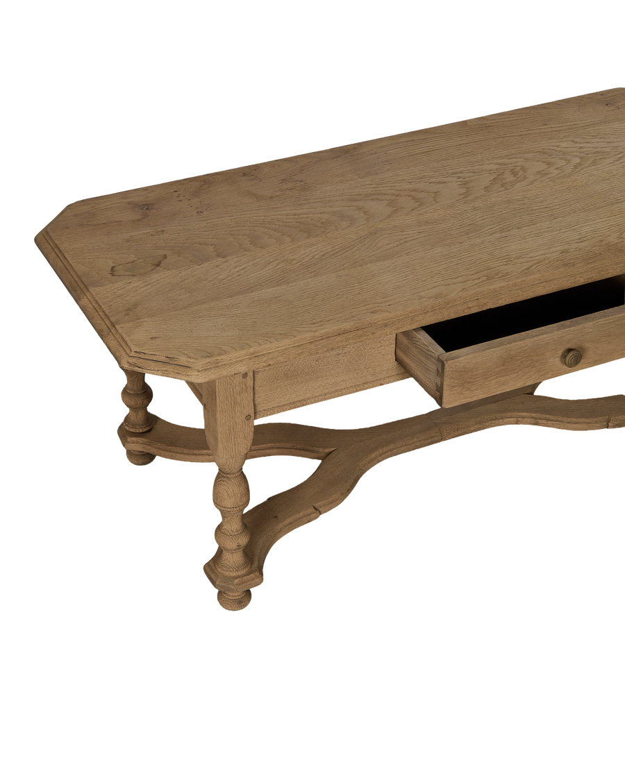 Vintage French Oak coffee table, showing opened dovetail drawer joinery and scrolled legs.