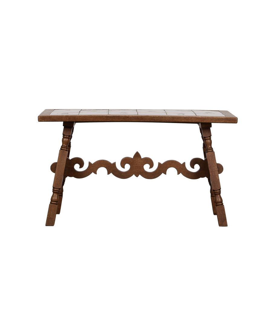 Vintage French oak Delft tile coffee table, detailed view of ornate carved base.