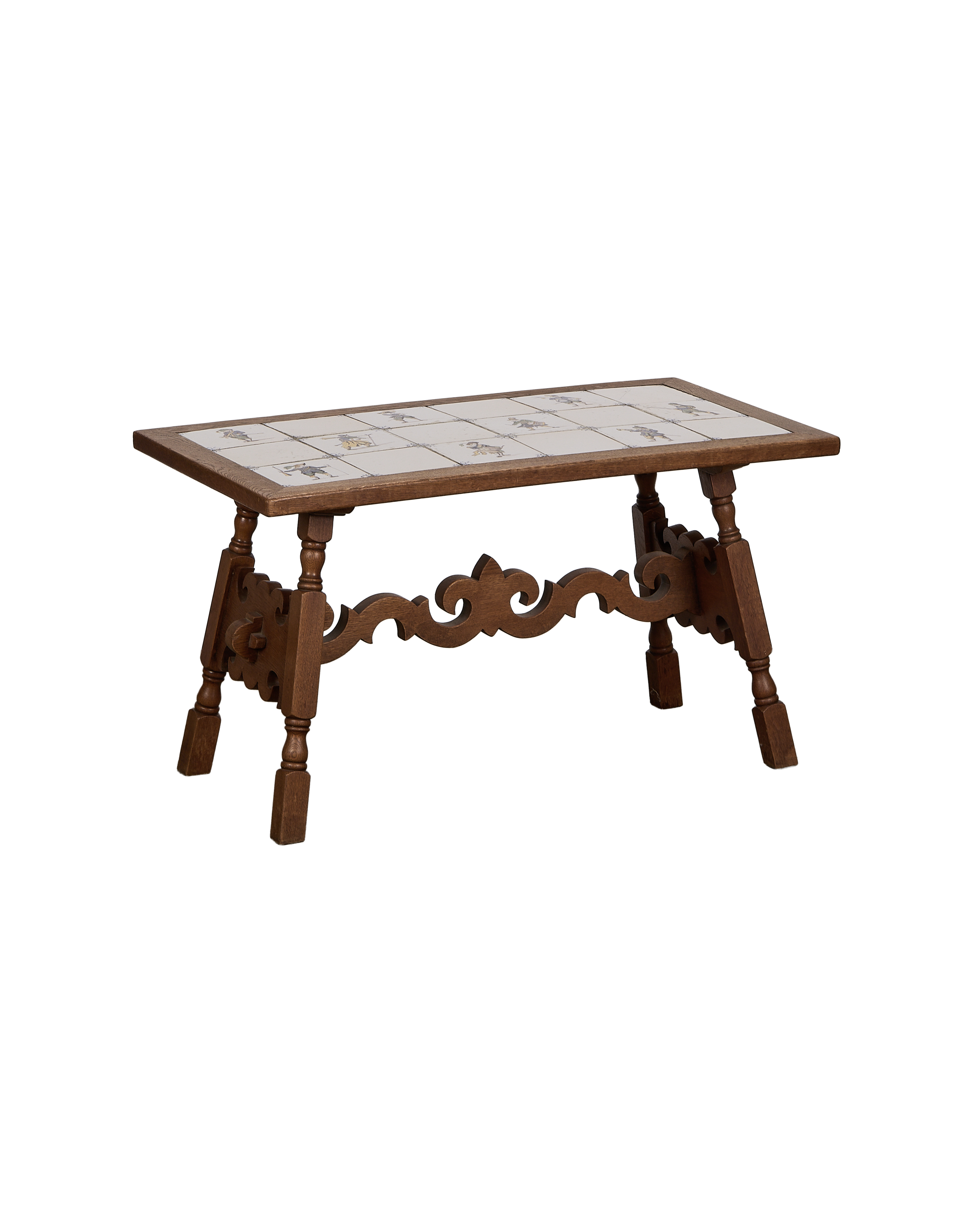 Vintage French oak coffee table with white Delft tile top and carved details.