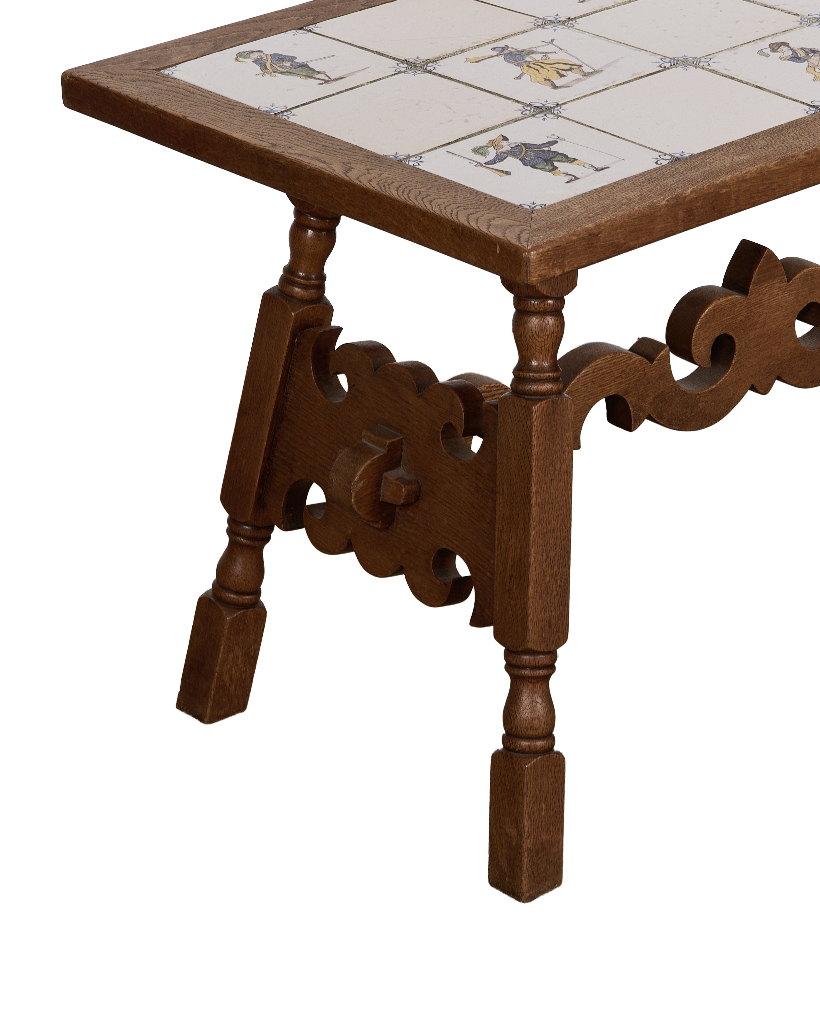 Vintage oak Delft tile coffee table, detailed view of carved base and one tiled corner.