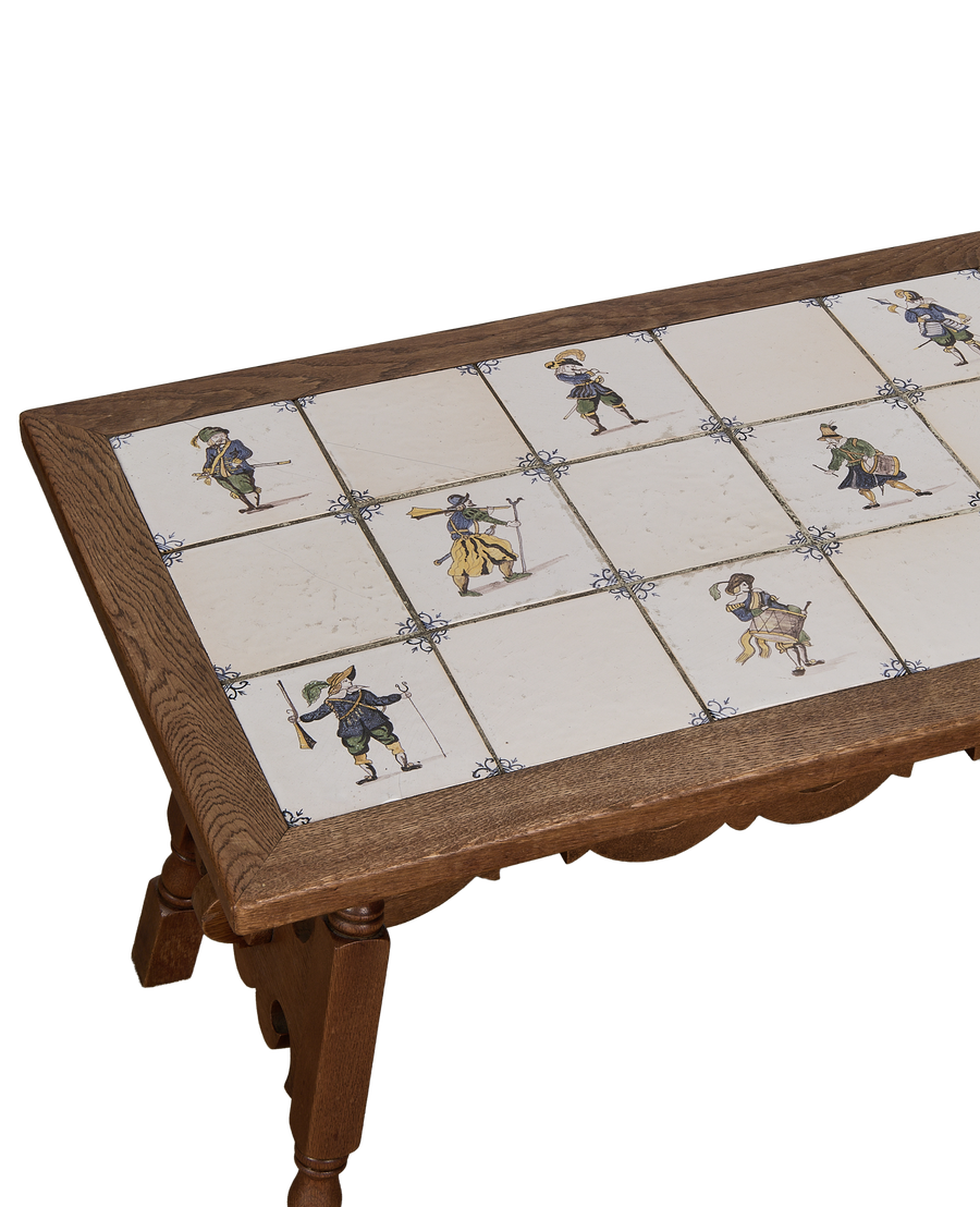 Close-up, vintage French oak Delft tile coffee table top with detailed individual warrior design.