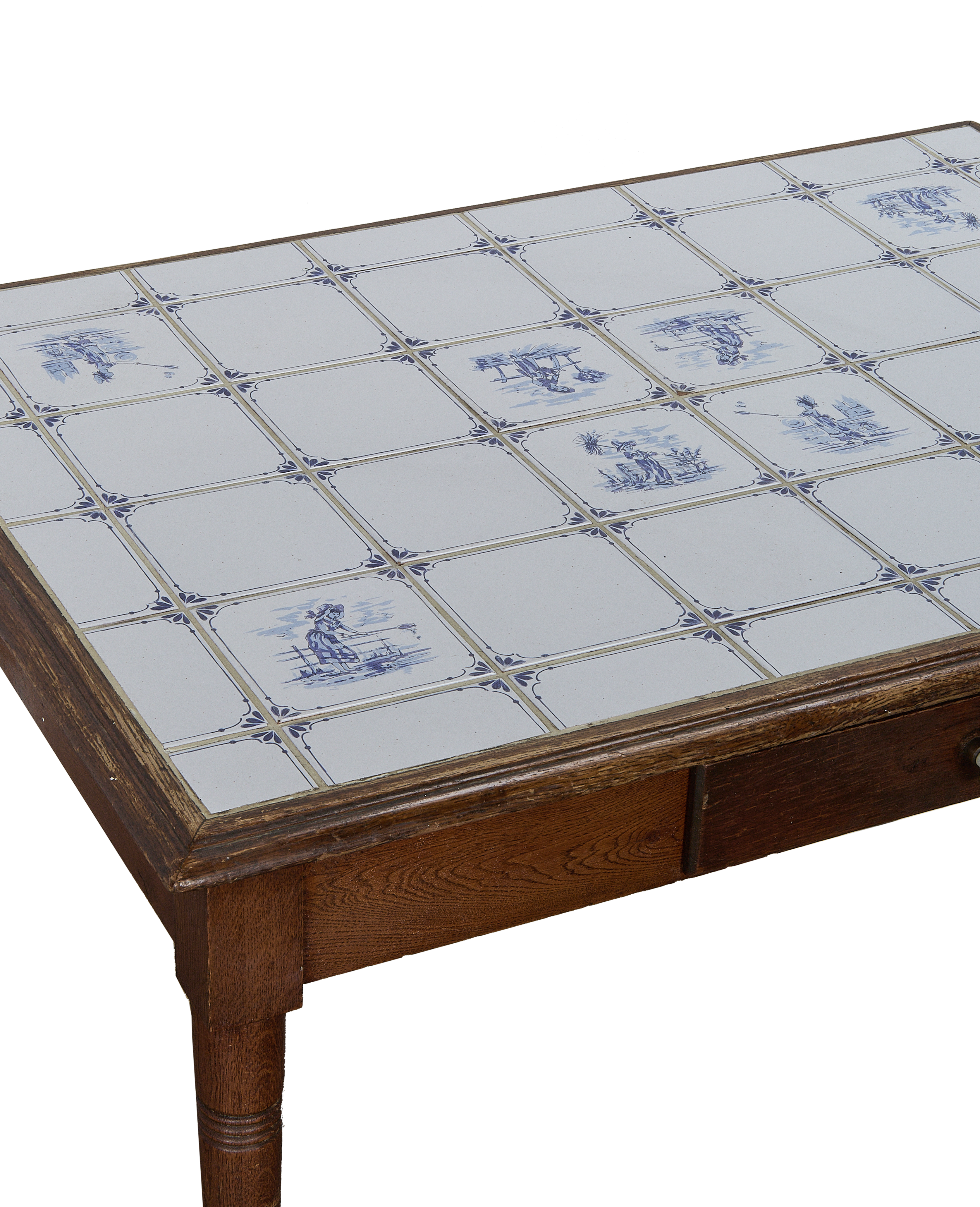 Vintage French oak Delft table with richly patterned blue and white ceramic tiles.