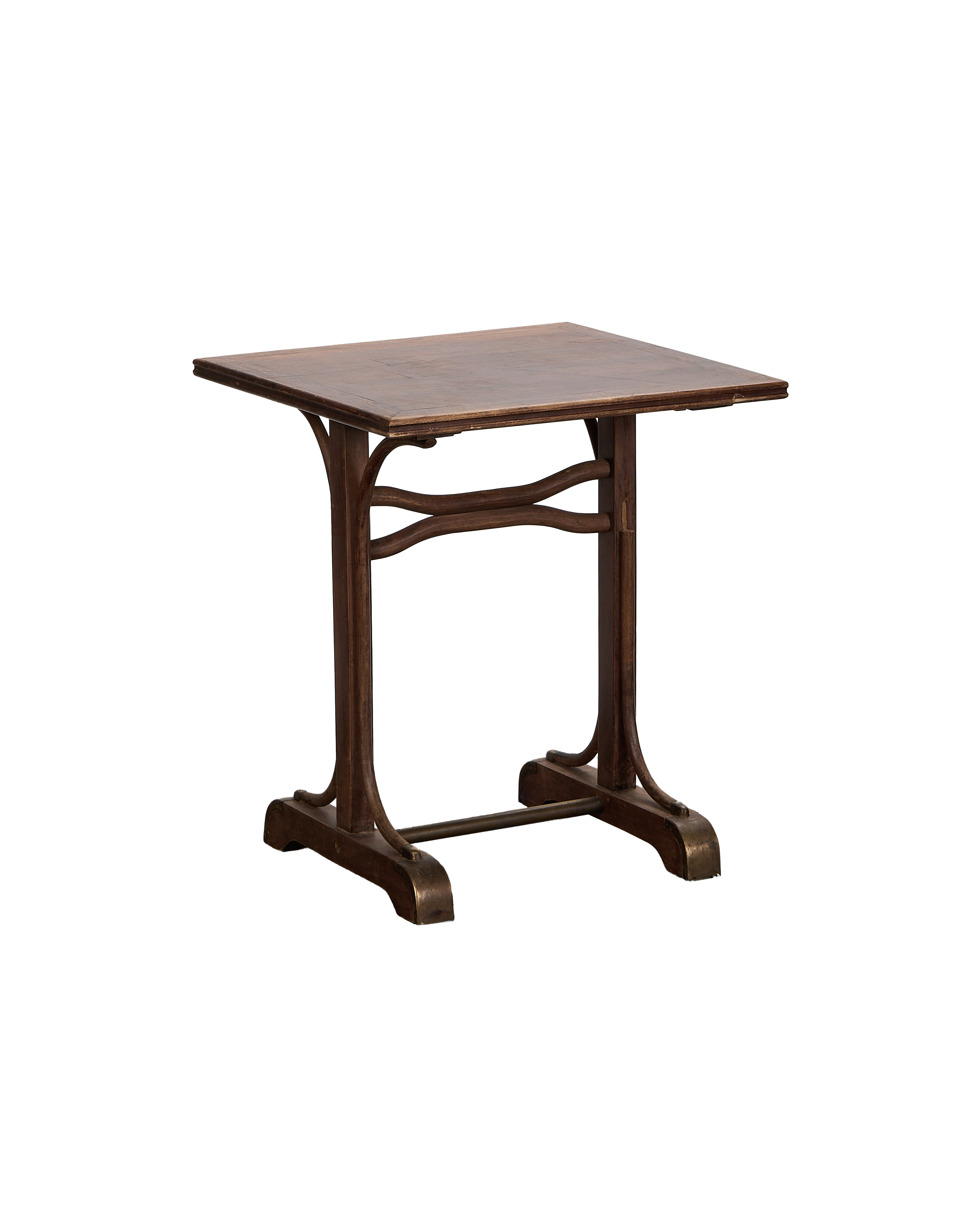 Vintage French oak writing desk's side profile, showing cross-stretchers and distressed brass feet.