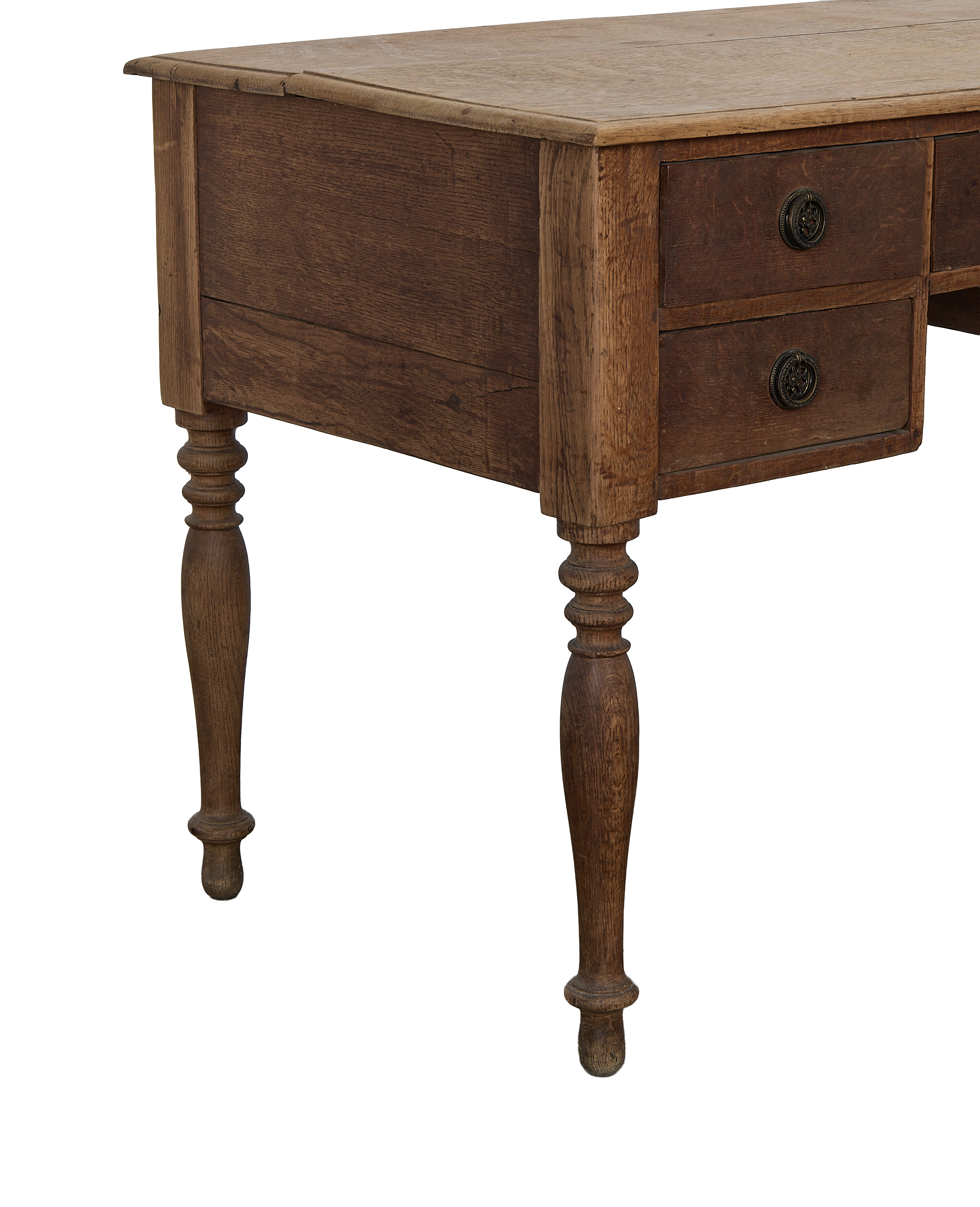 Vintage French oak desk, close-up of aged wood, ornate drawer pull, turned leg.