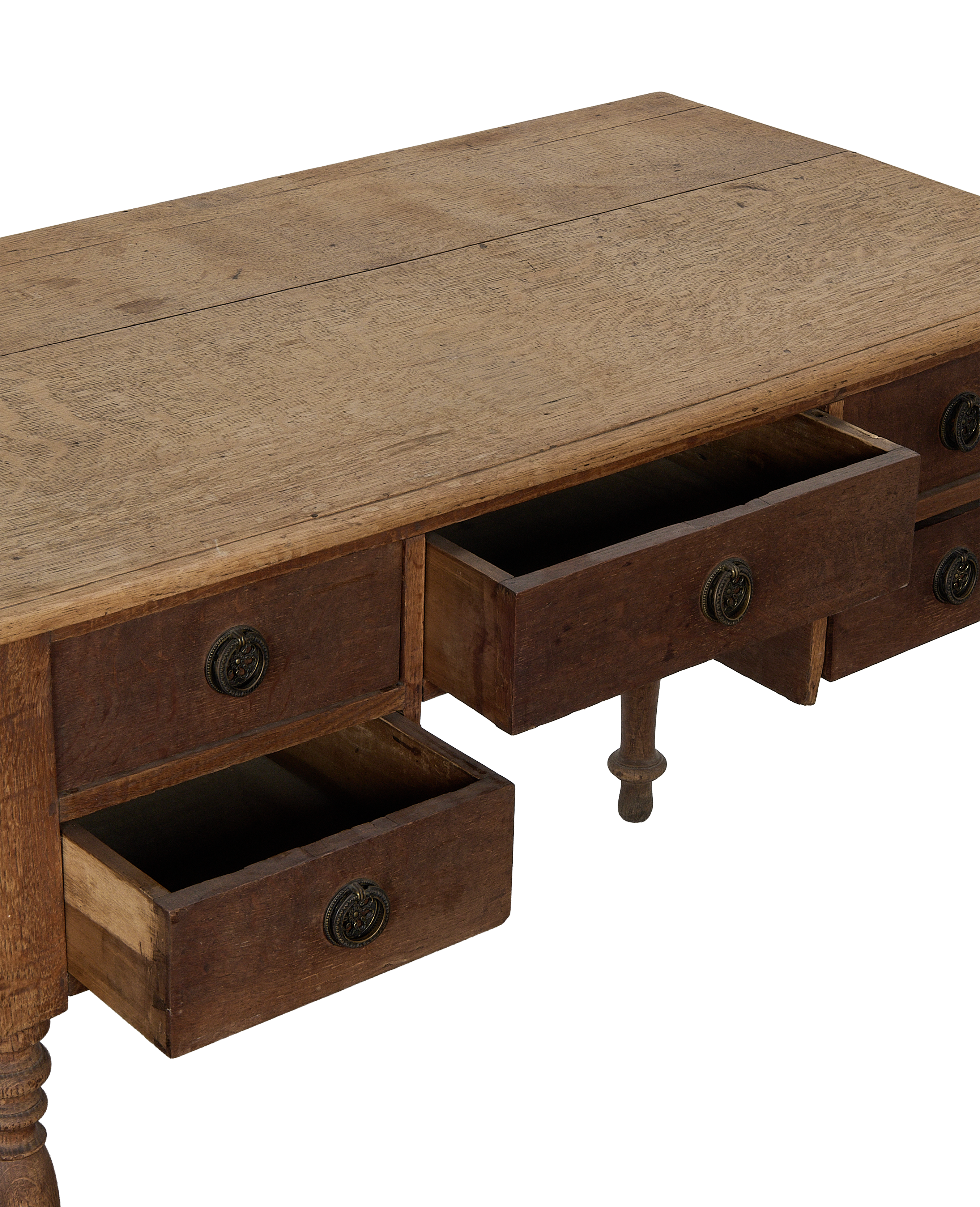 Vintage French oak wood desk, two drawers open showing construction and aged brass pulls.