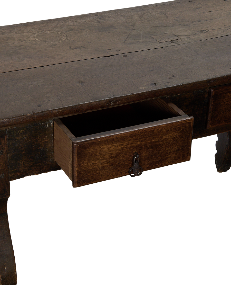 Open drawer and keyhole pull on antique French oak vintage table.