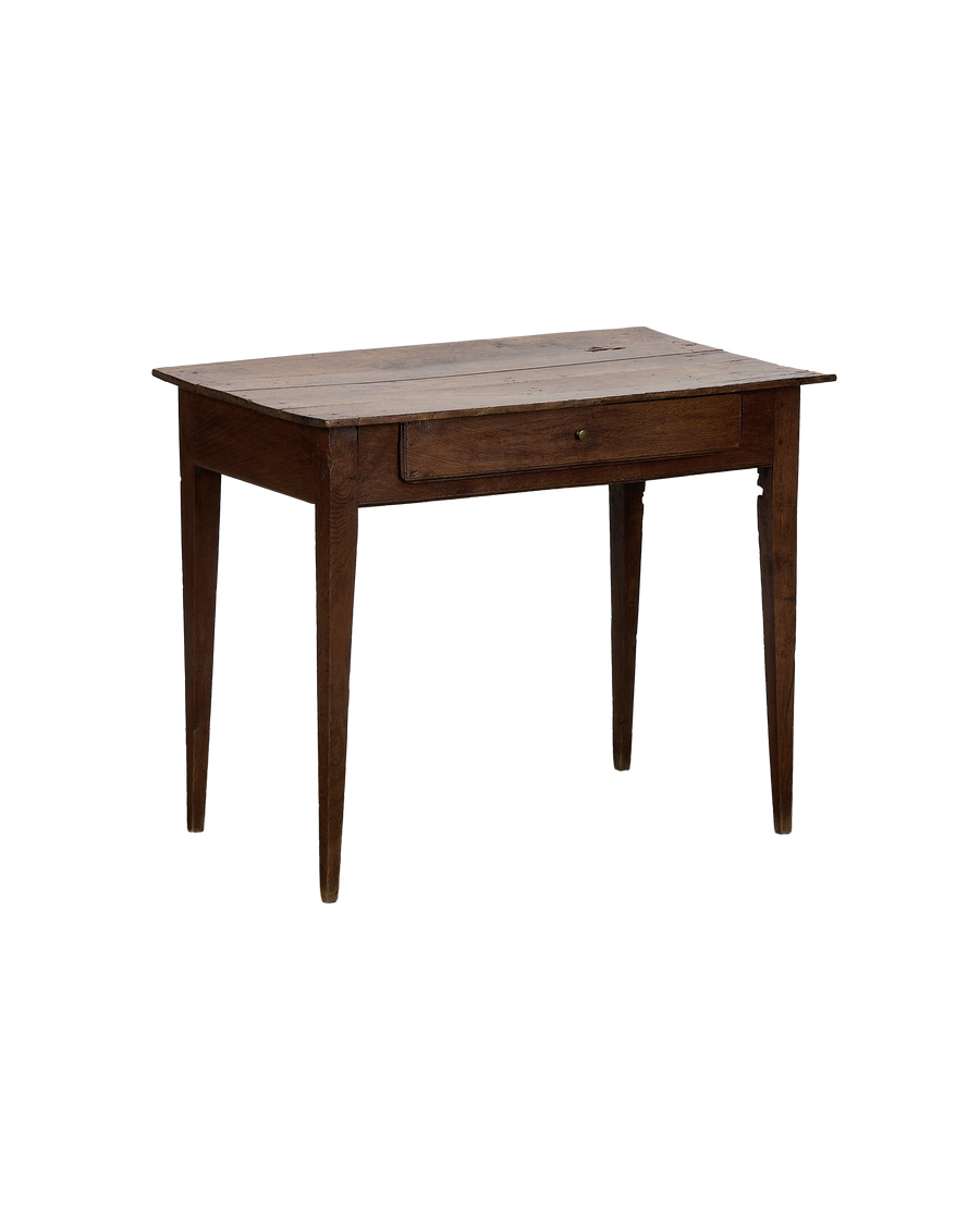 Vintage French oak wood desk showing drawer detail and distressed surface.