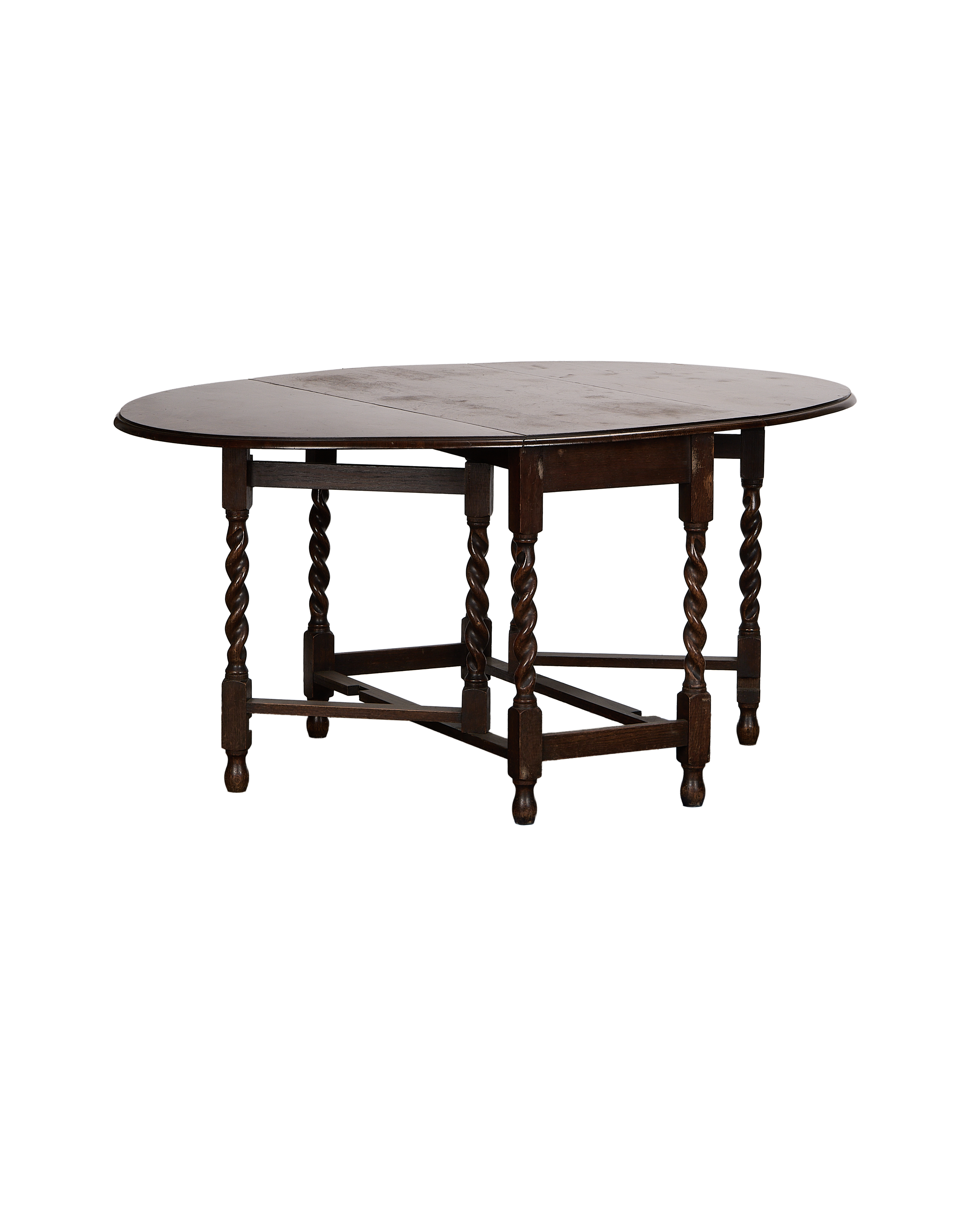 Vintage French oak gate leg table, closed oval top, with twisted barley-twist legs.