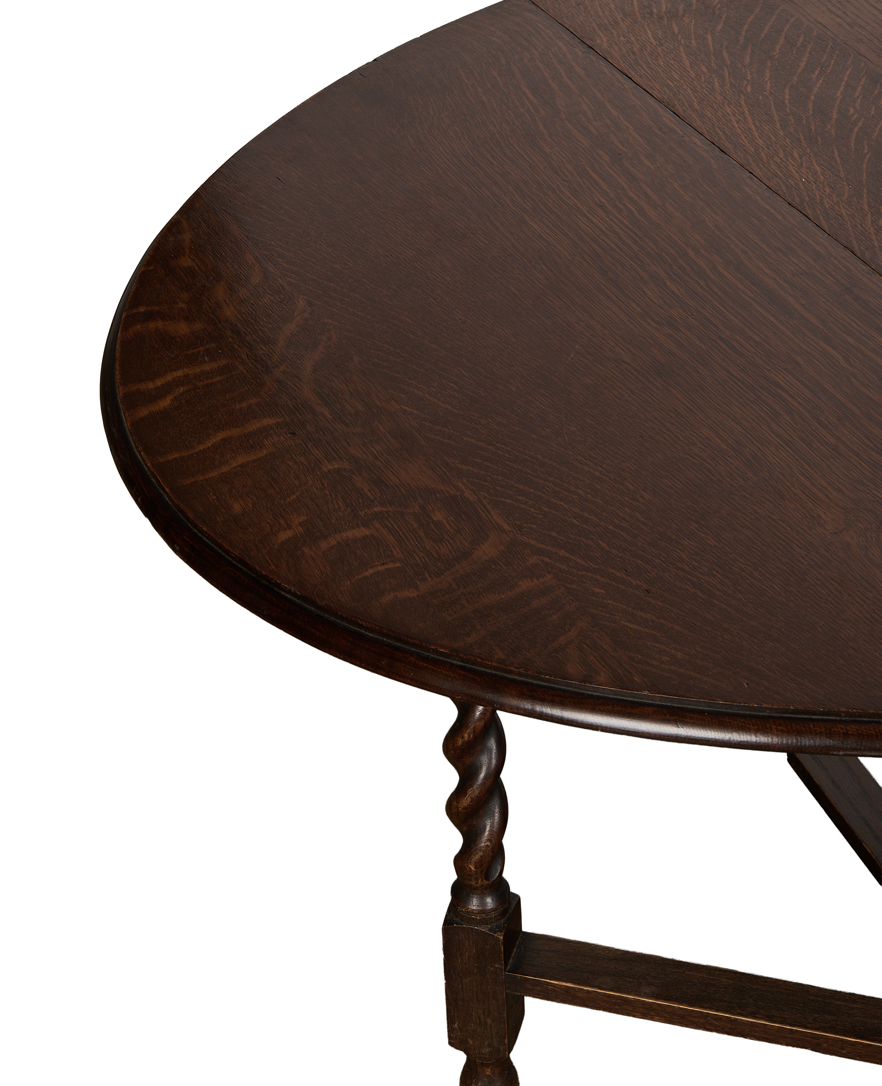 Vintage French oak gate leg table, showing a detailed view of its turned leg.