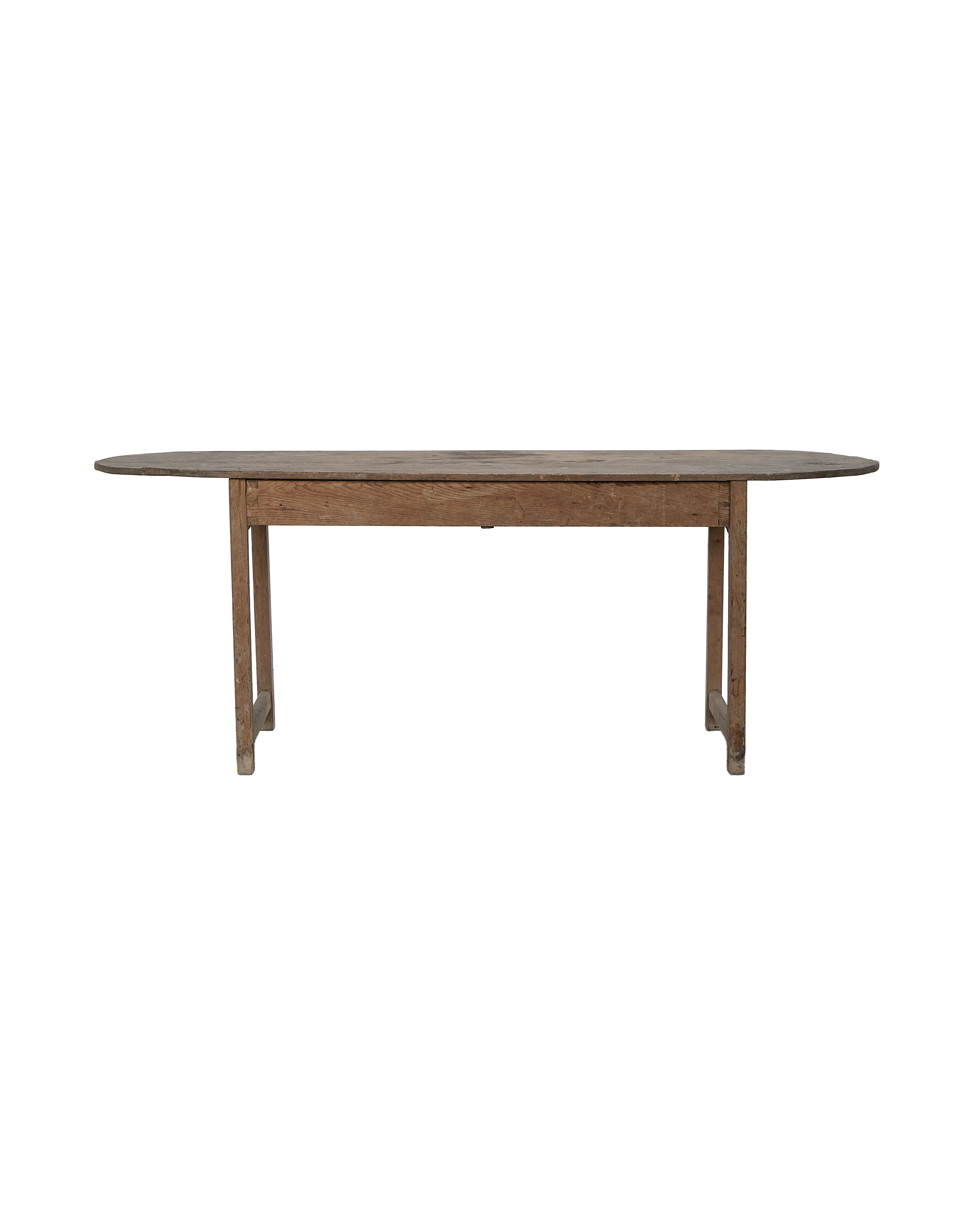 Vintage French oak oval dining table's full left-side view showing aged wood.