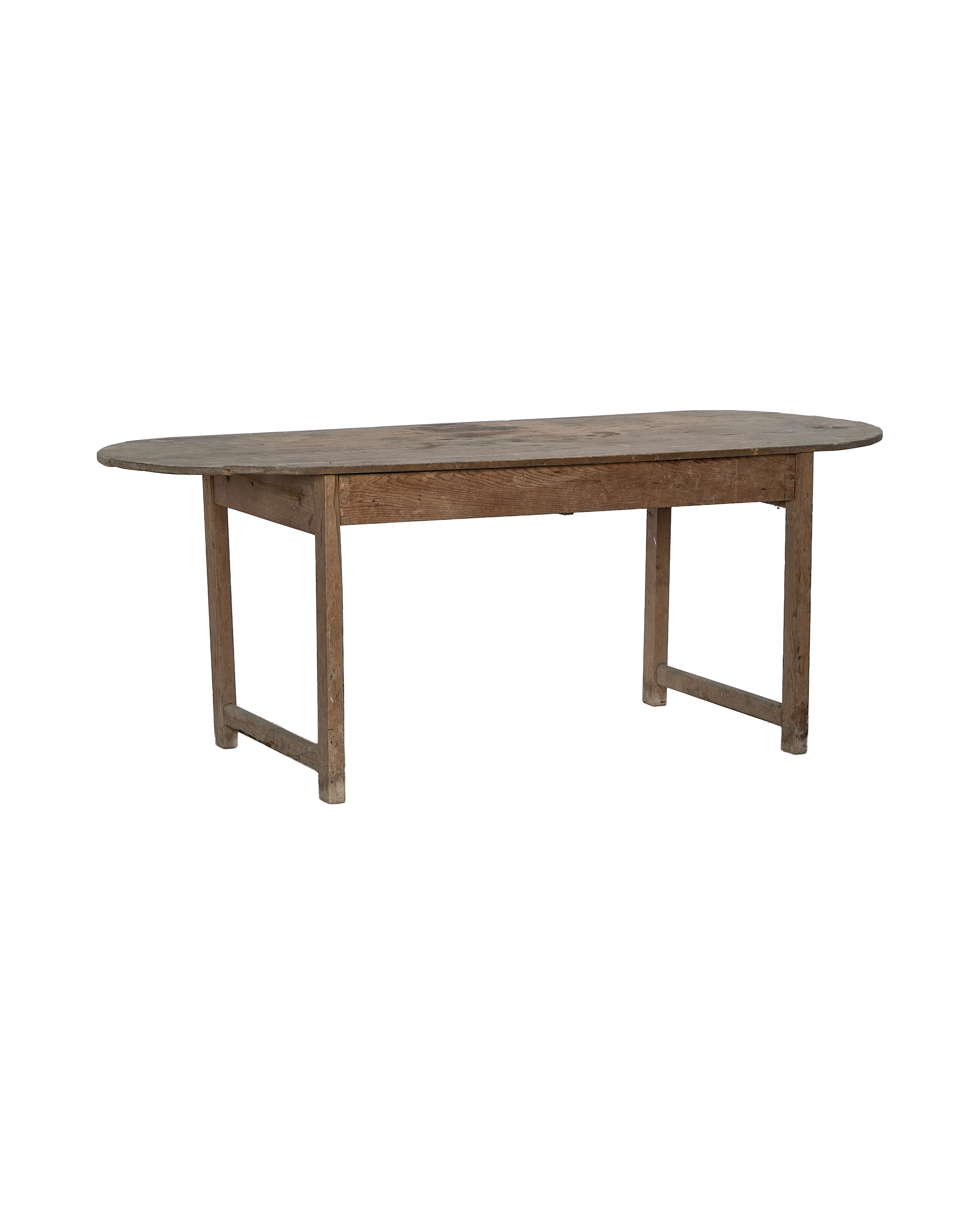 Vintage French oval oak dining table with rustic, distressed light wood finish.
