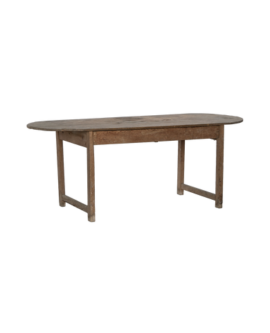 Vintage French oval oak dining table with rustic, distressed light wood finish.