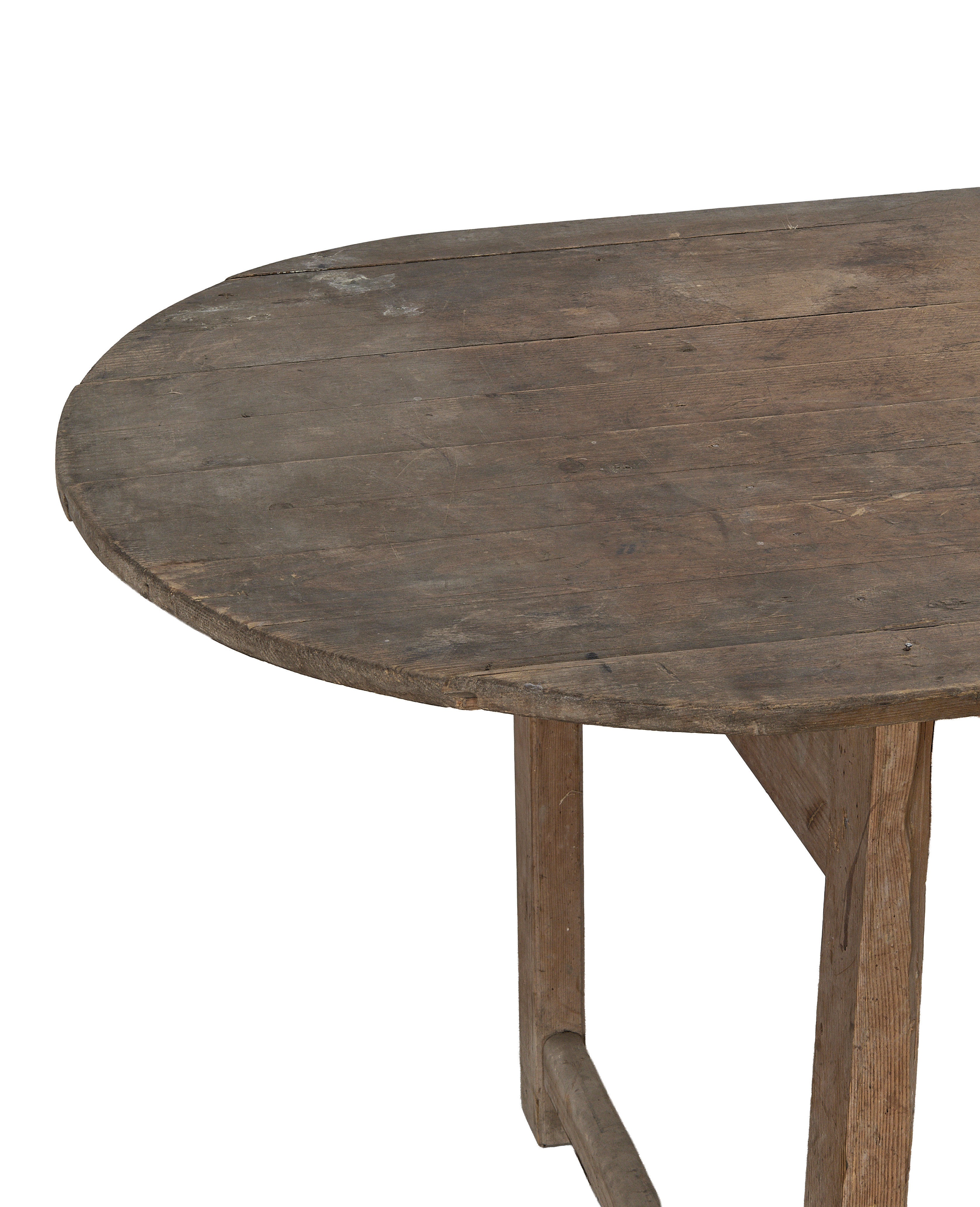 Vintage French oval oak dining table, detailed top view of rustic wood grain.