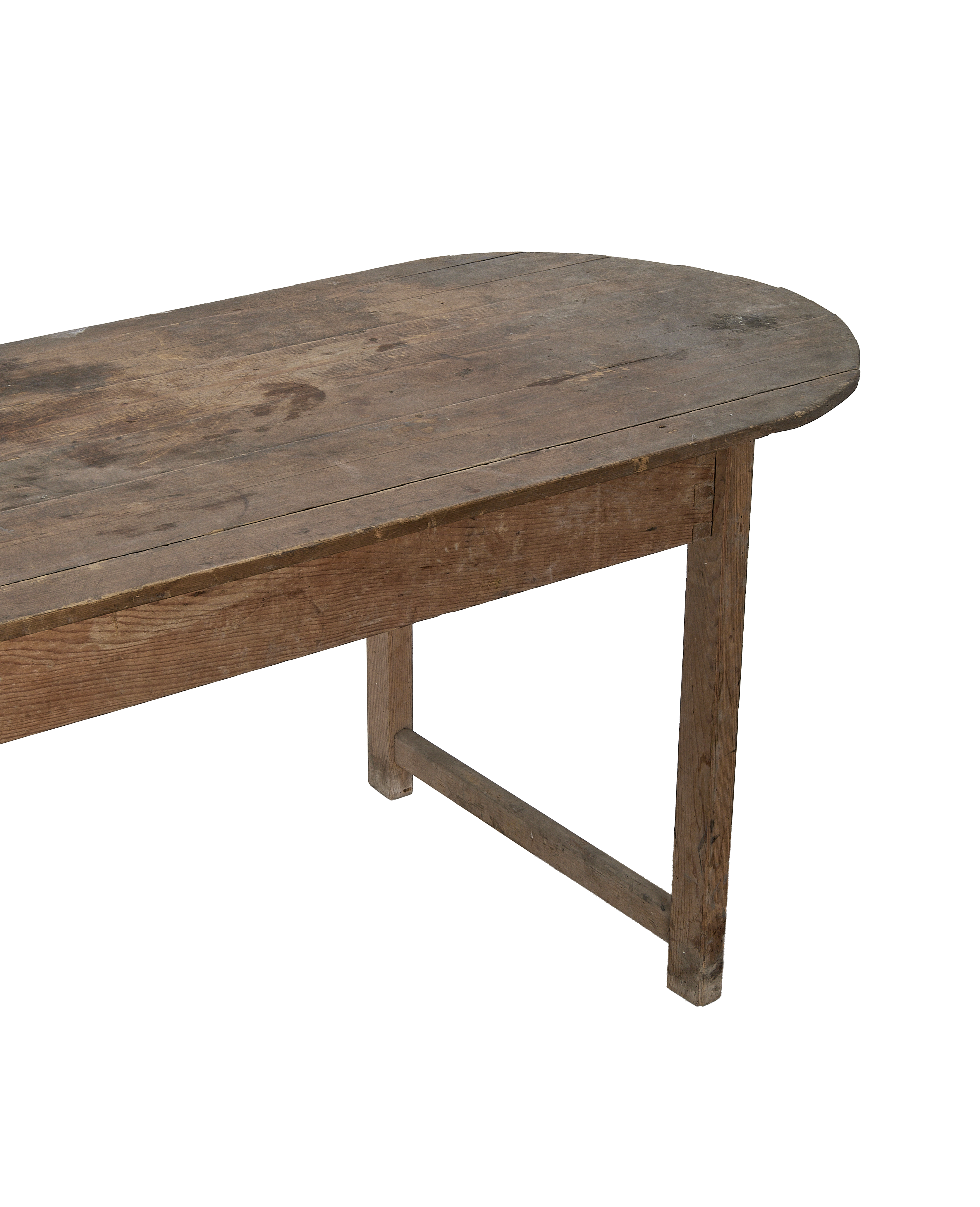 Vintage French oval oak dining table showing rustic plank top and sturdy aged legs.