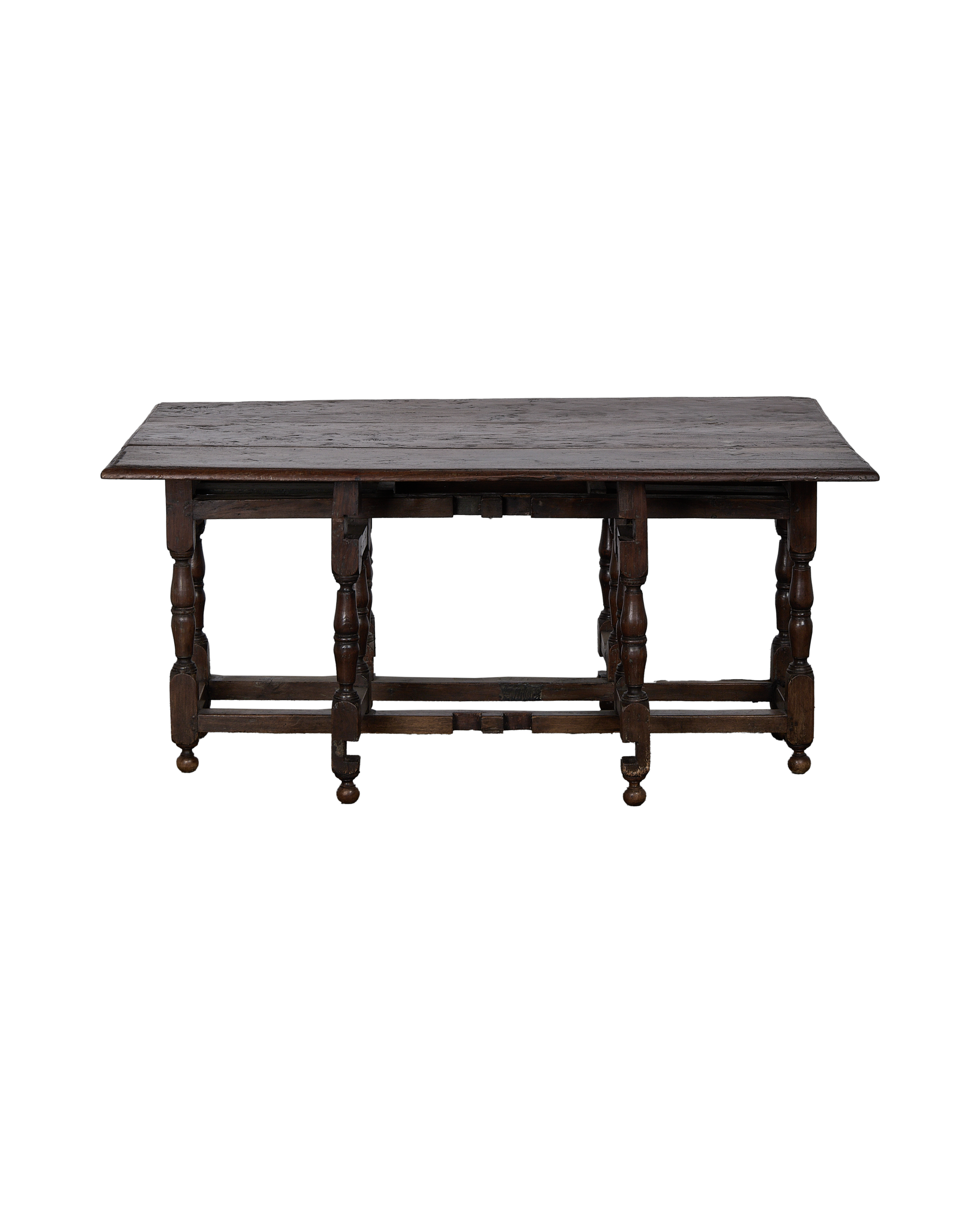 Vintage Spanish oak folding table, showing side view with unfolded leaves.