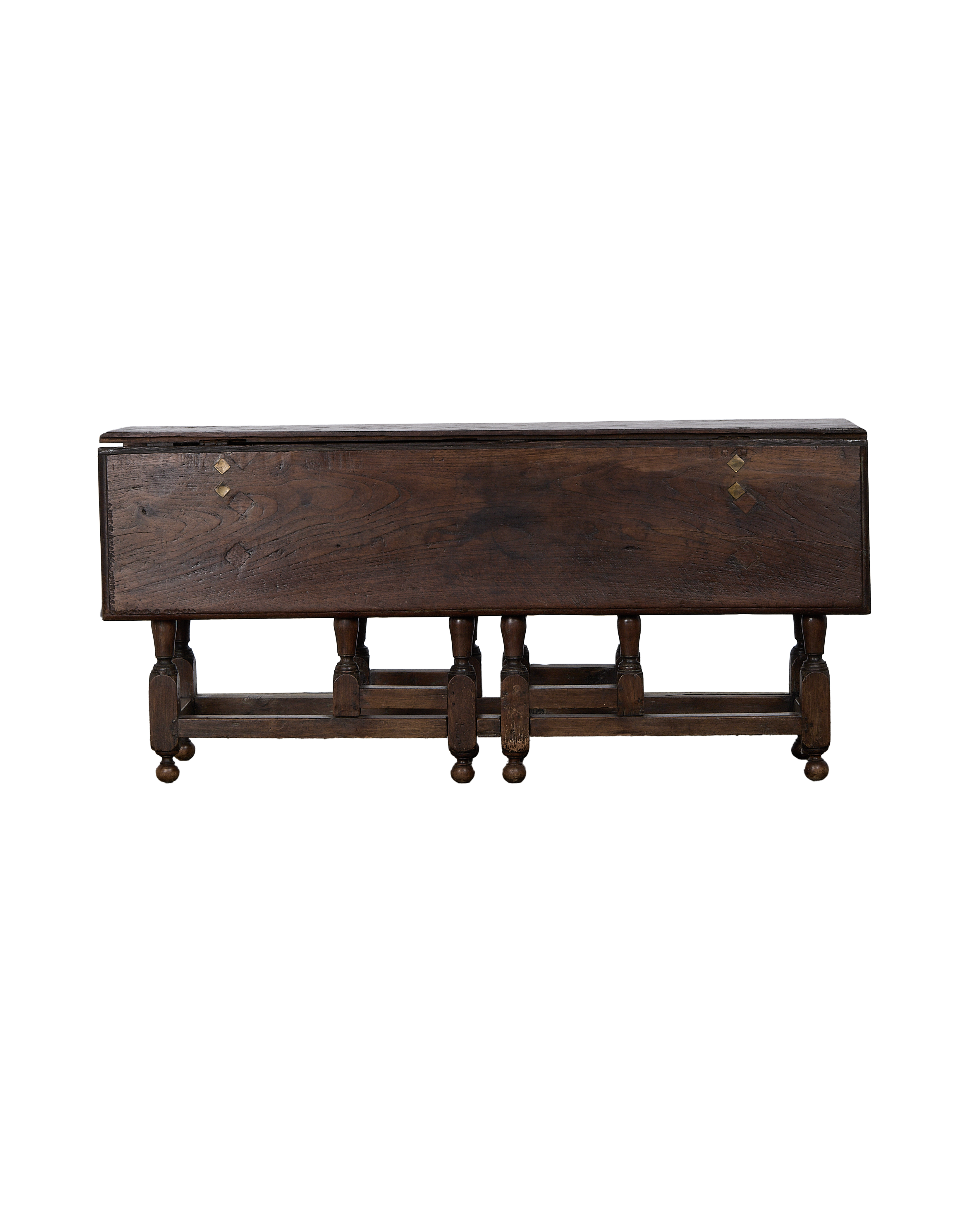 Vintage French oak folding table, rich dark wood, brass diamond accents, folded view.