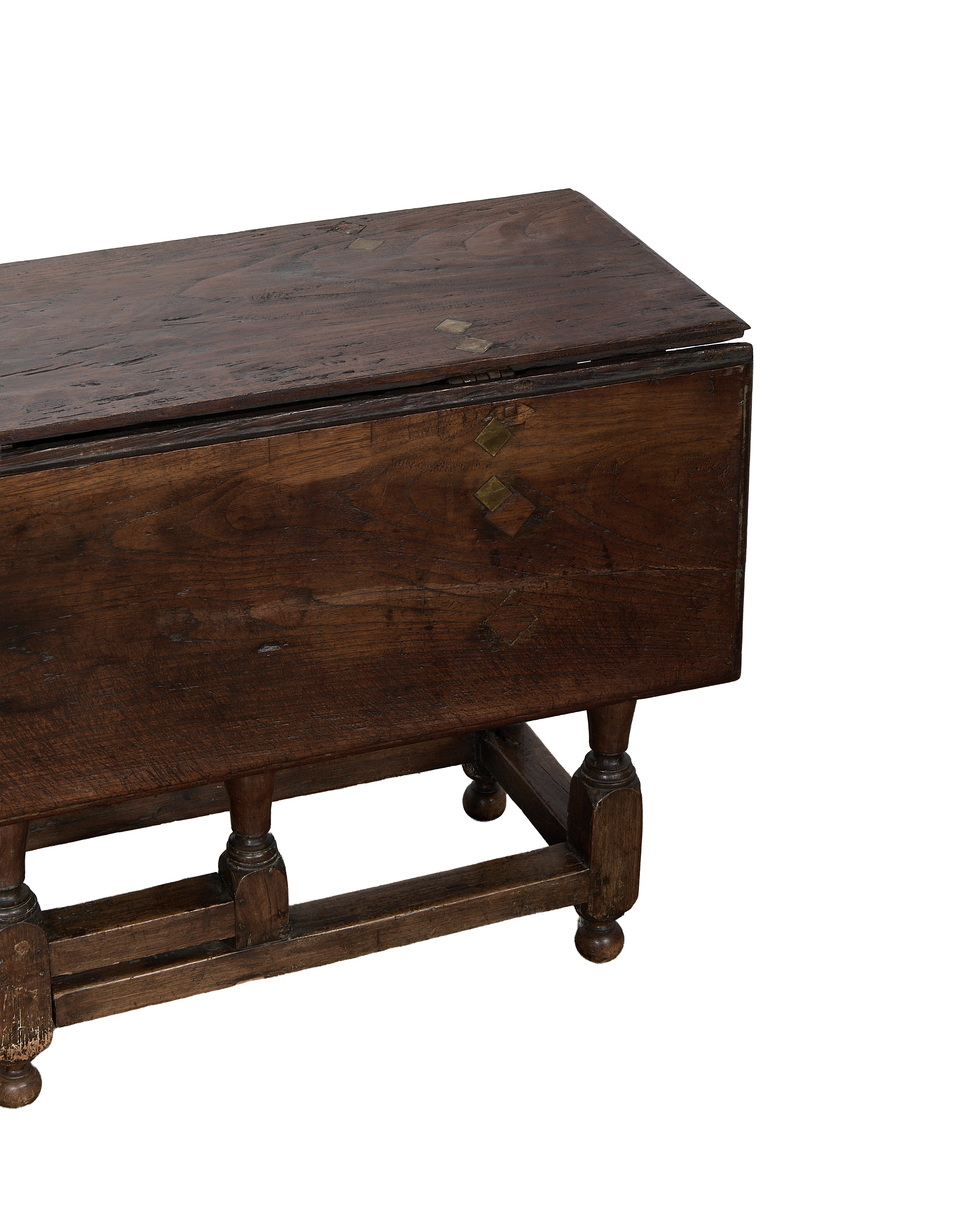 Vintage Spanish folding oak table, brass diamond inlay detail, turned legs, warm patina.