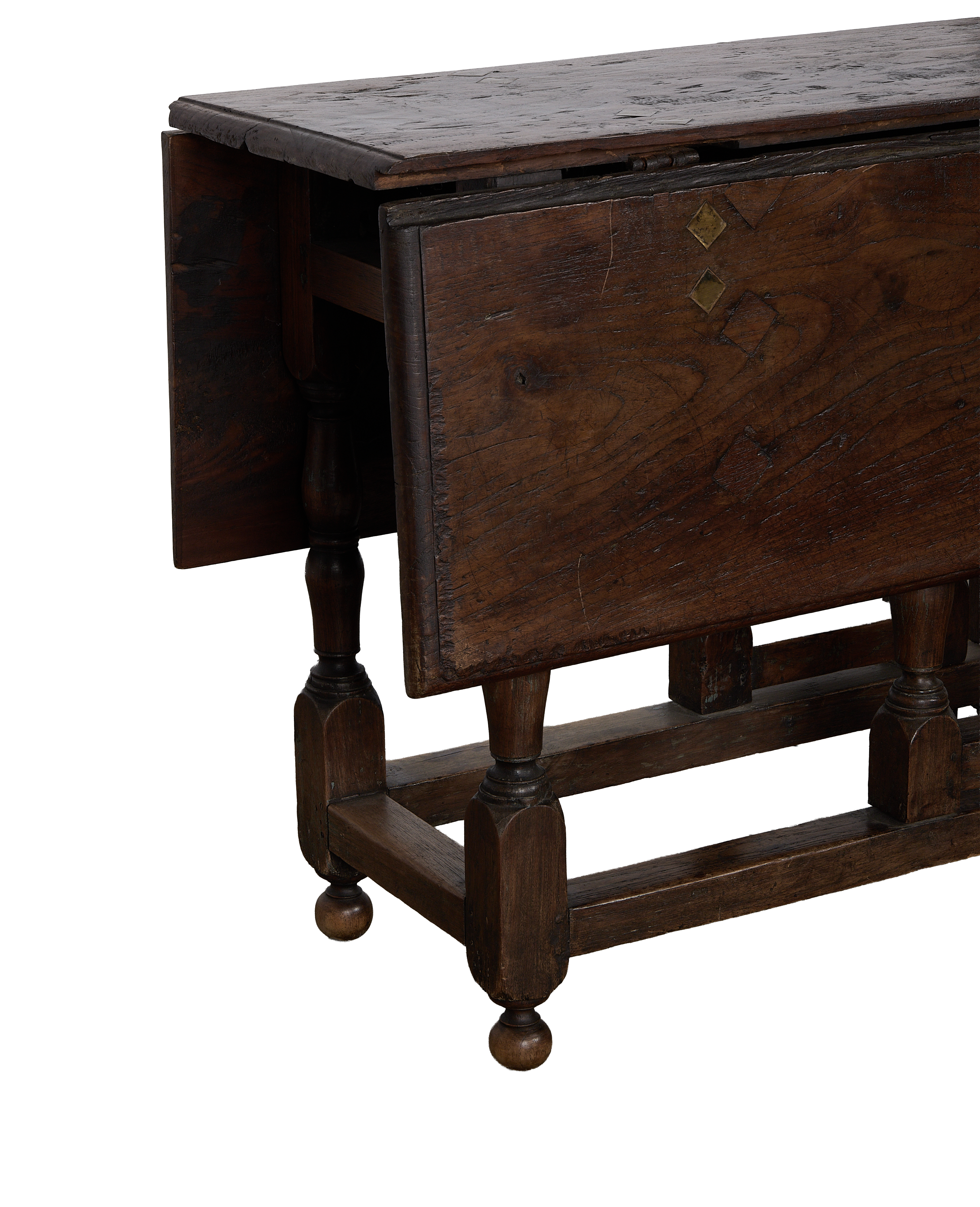 Vintage Spanish oak folding table, brass diamond inlays, shown partially folded, dark aged wood.