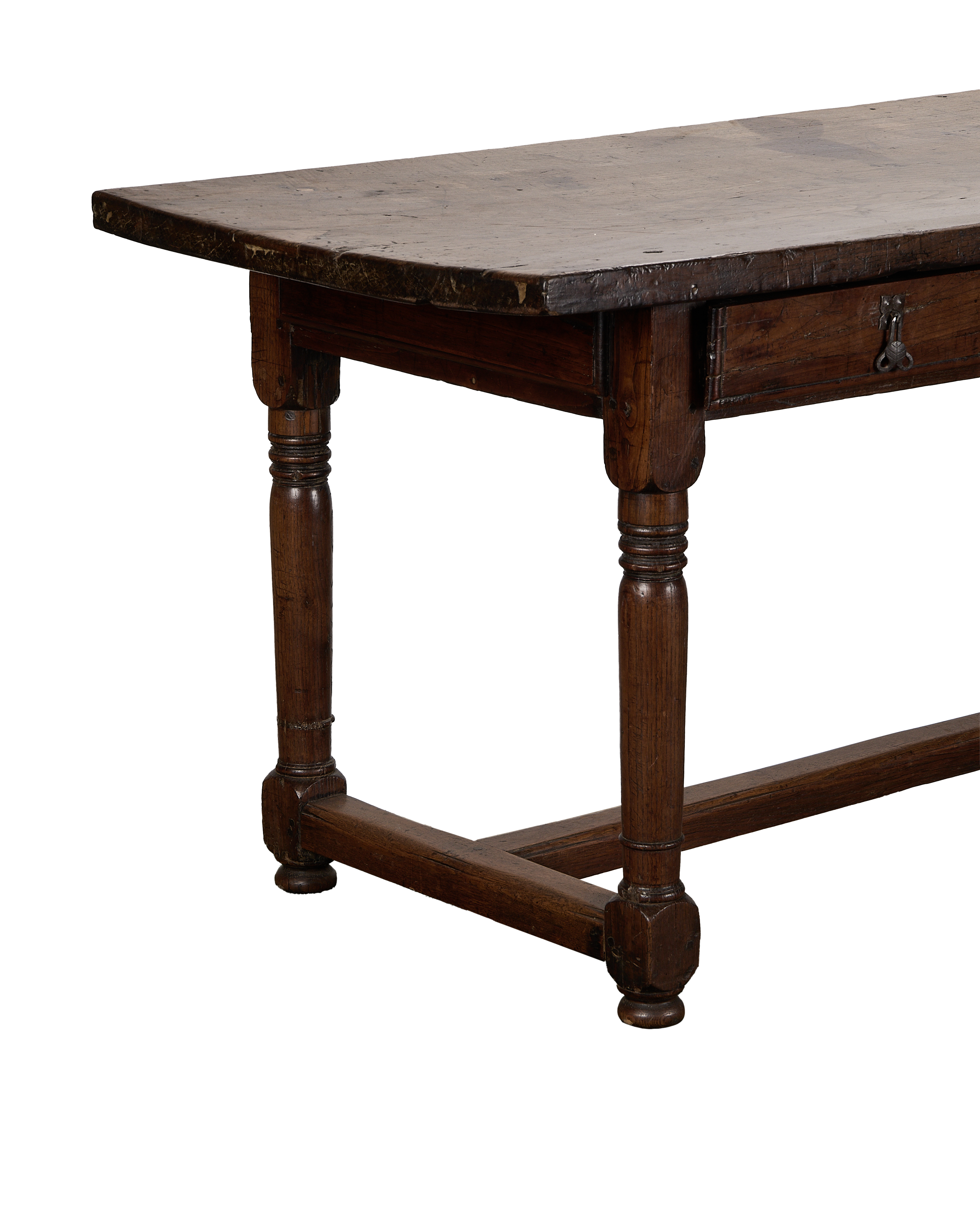 Antique French 18th-century oak drawer table, showing turned legs and distressed tabletop.