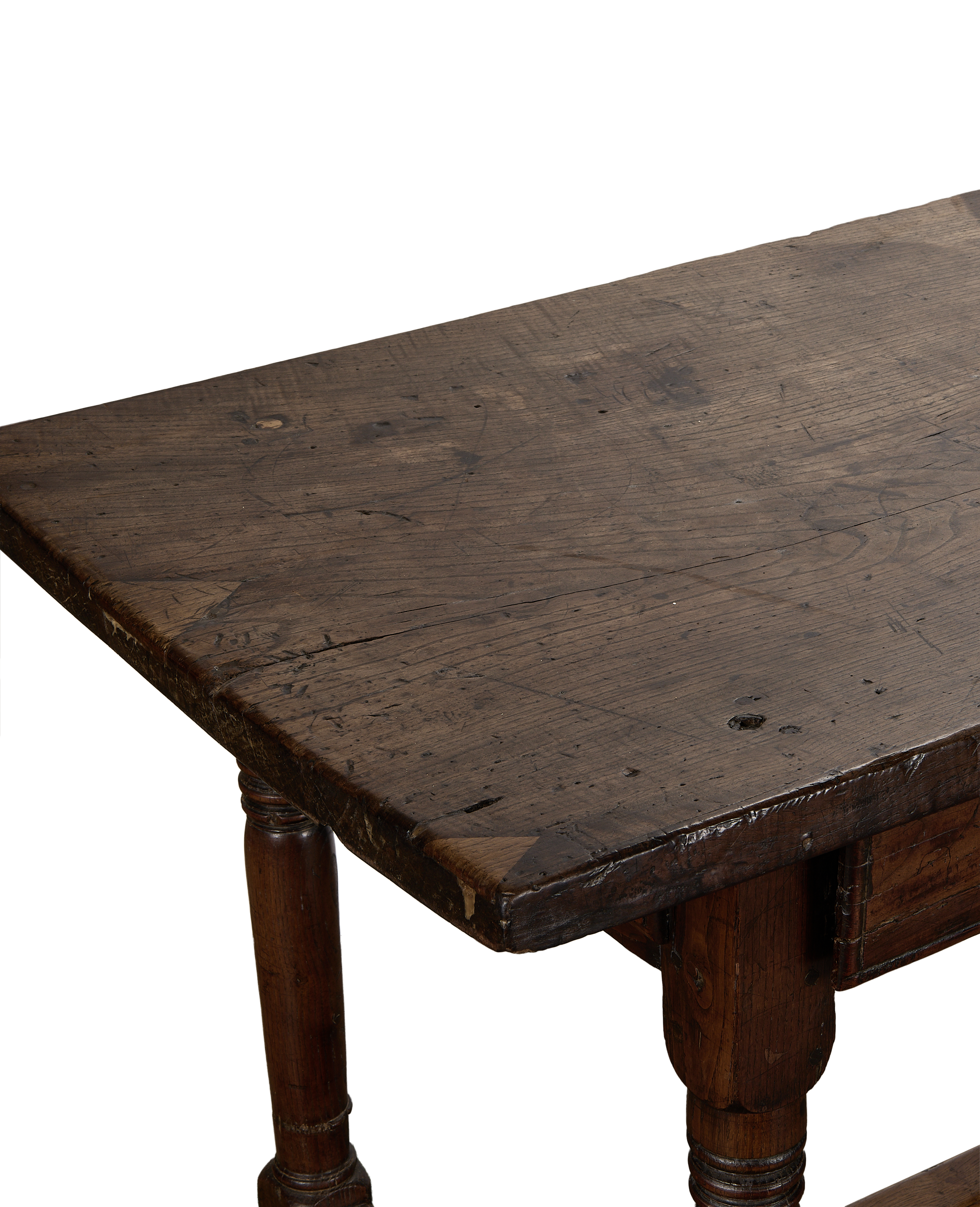 Close-up of antique 18th Century French oak drawer table top showcasing distressed patina.