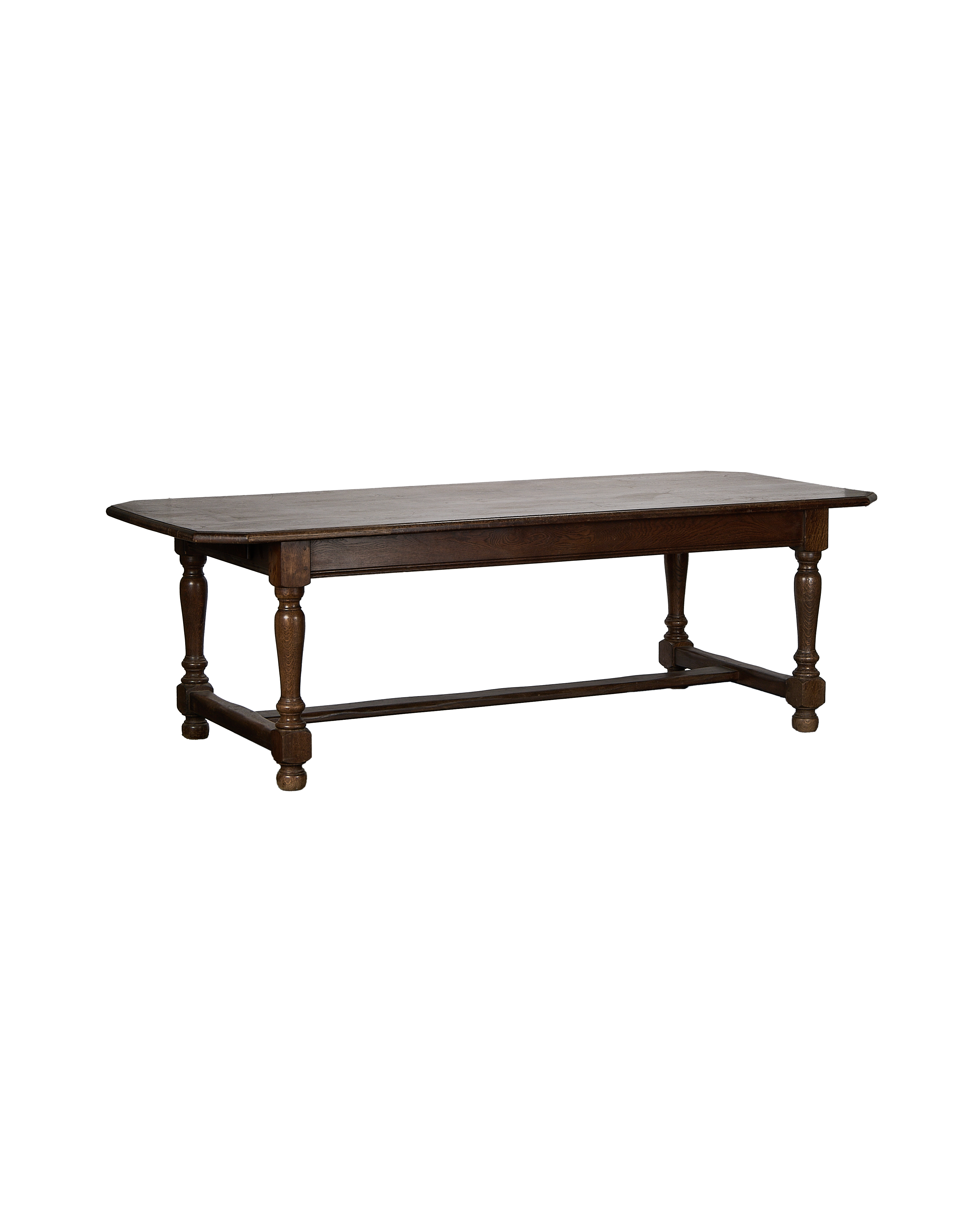 Vintage French oak Drapers dining table, long view, showing lower stretcher and turned legs.