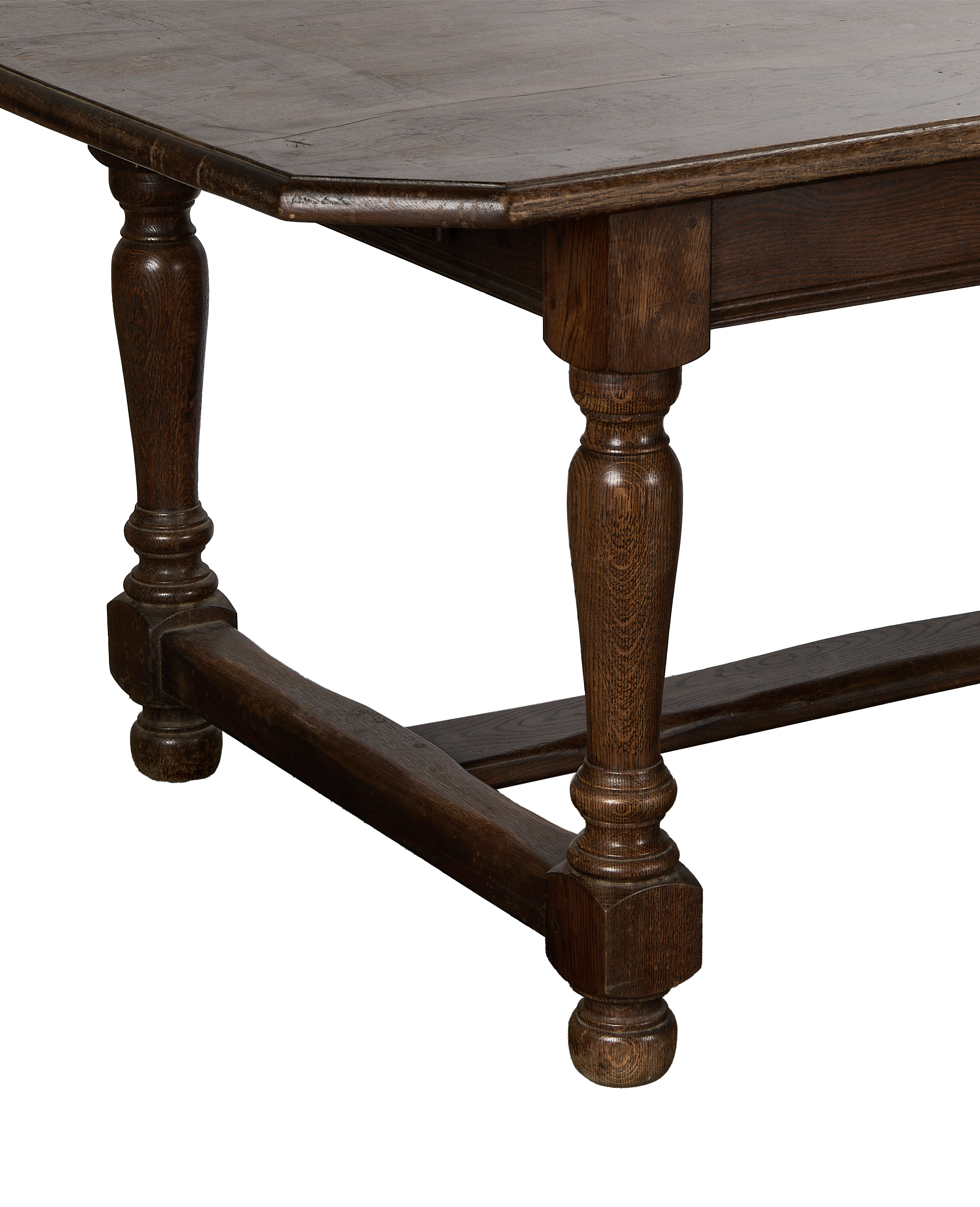 Vintage French oak dining table leg, showing turned detail and stretcher base.