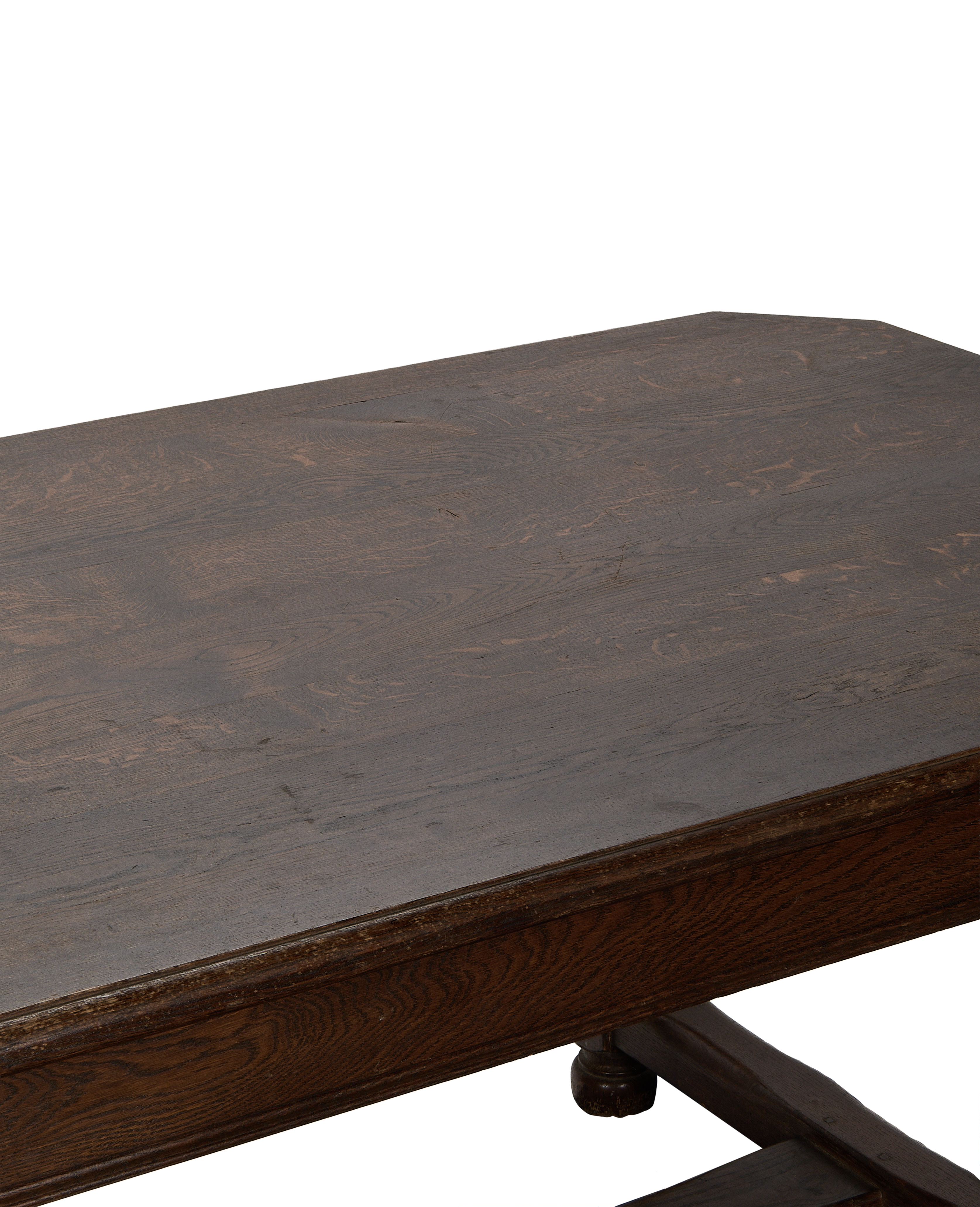 Close-up of vintage French oak dining table surface, showcasing distressed wood grain detail.