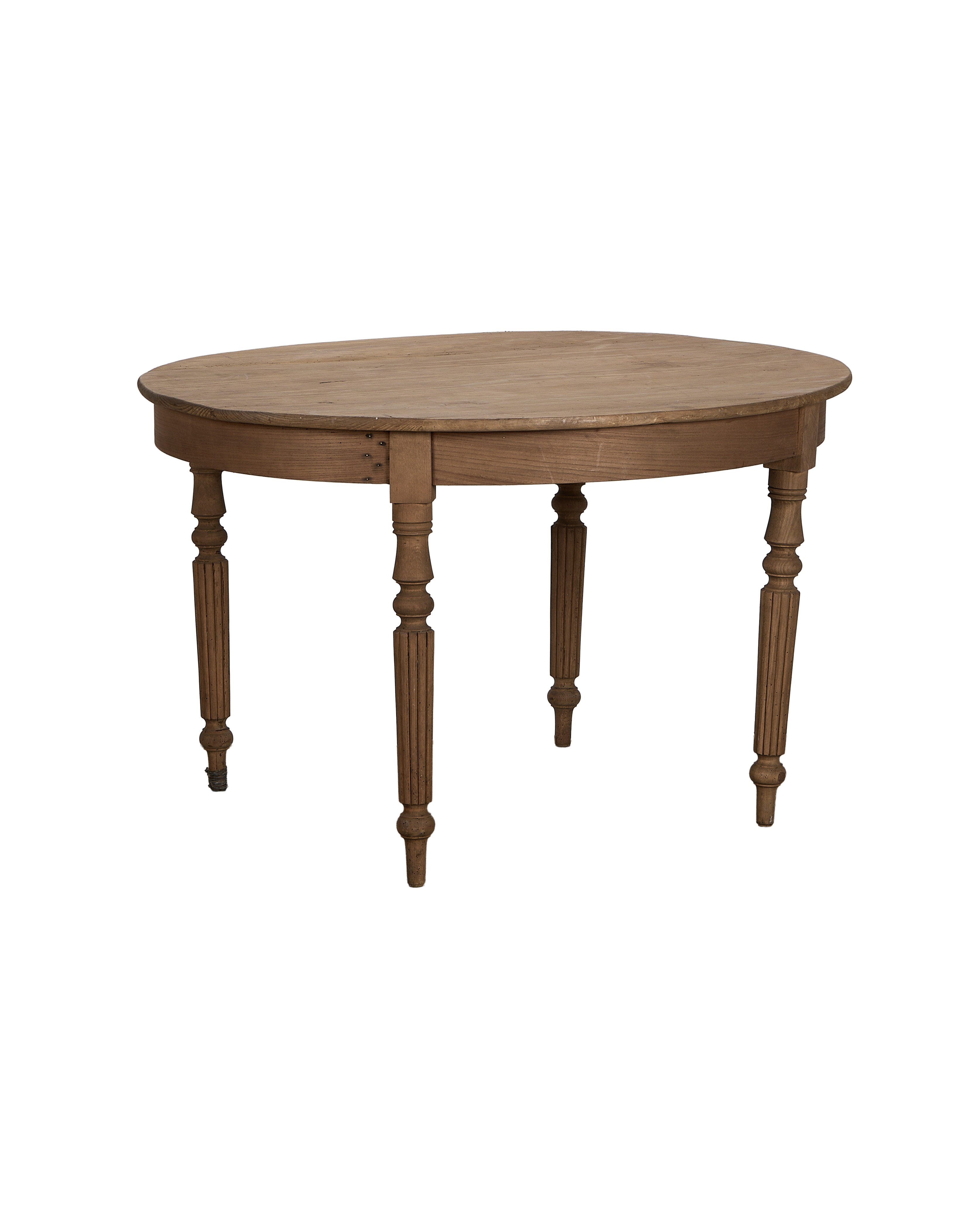 Vintage French round oak farmhouse dining table, angled view highlighting turned legs.