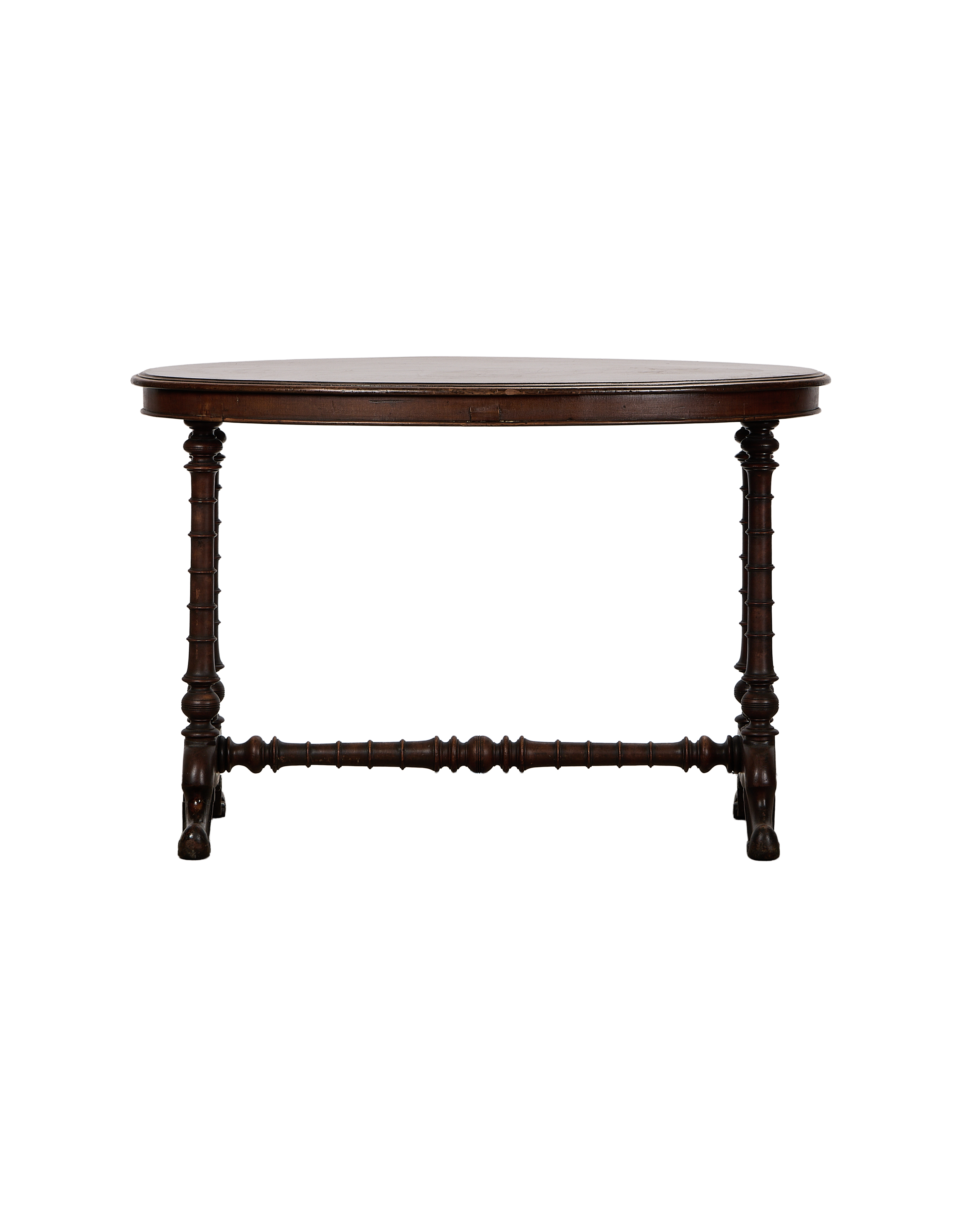 Vintage French oval oak entry table with turned spindle legs and stretcher bar.
