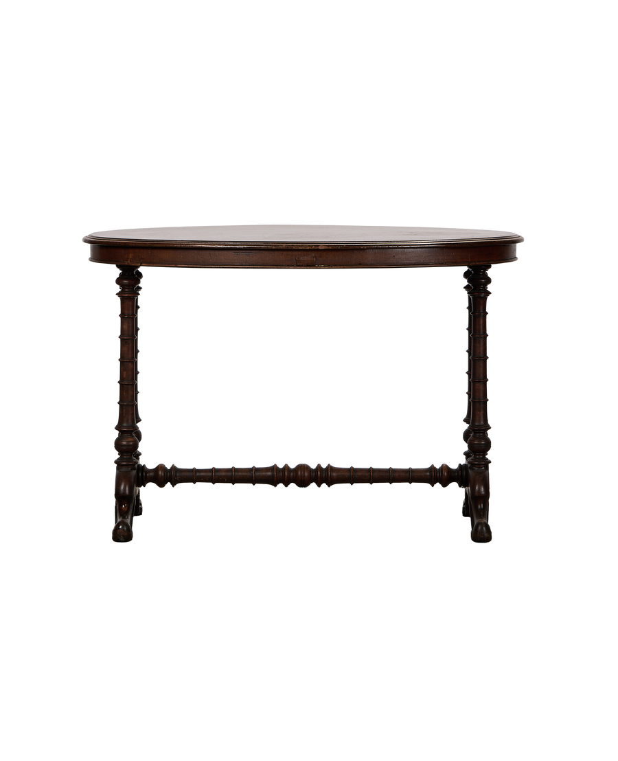 Vintage French oval oak entry table with turned spindle legs and stretcher bar.