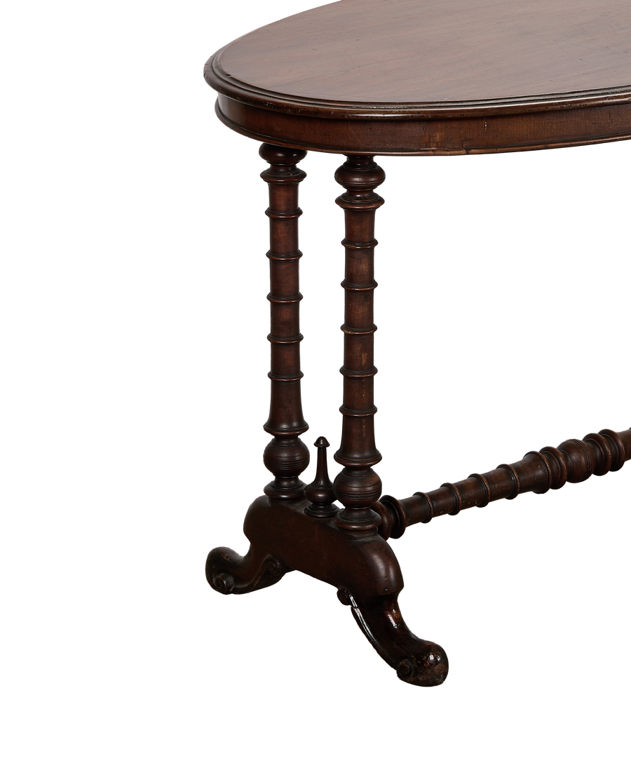 Vintage French oval oak entry table, showing carved turned legs, stretcher, and scrolled feet.