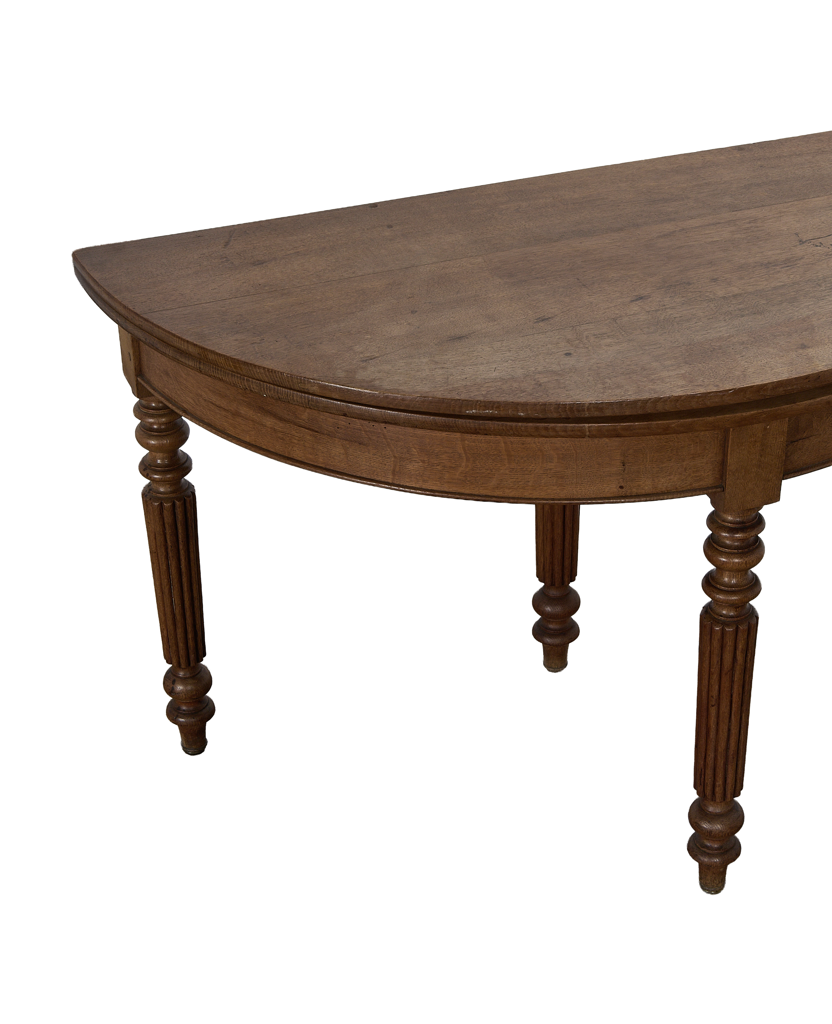 Vintage French oak demi-lune folding table, showing detailed fluted and turned legs.